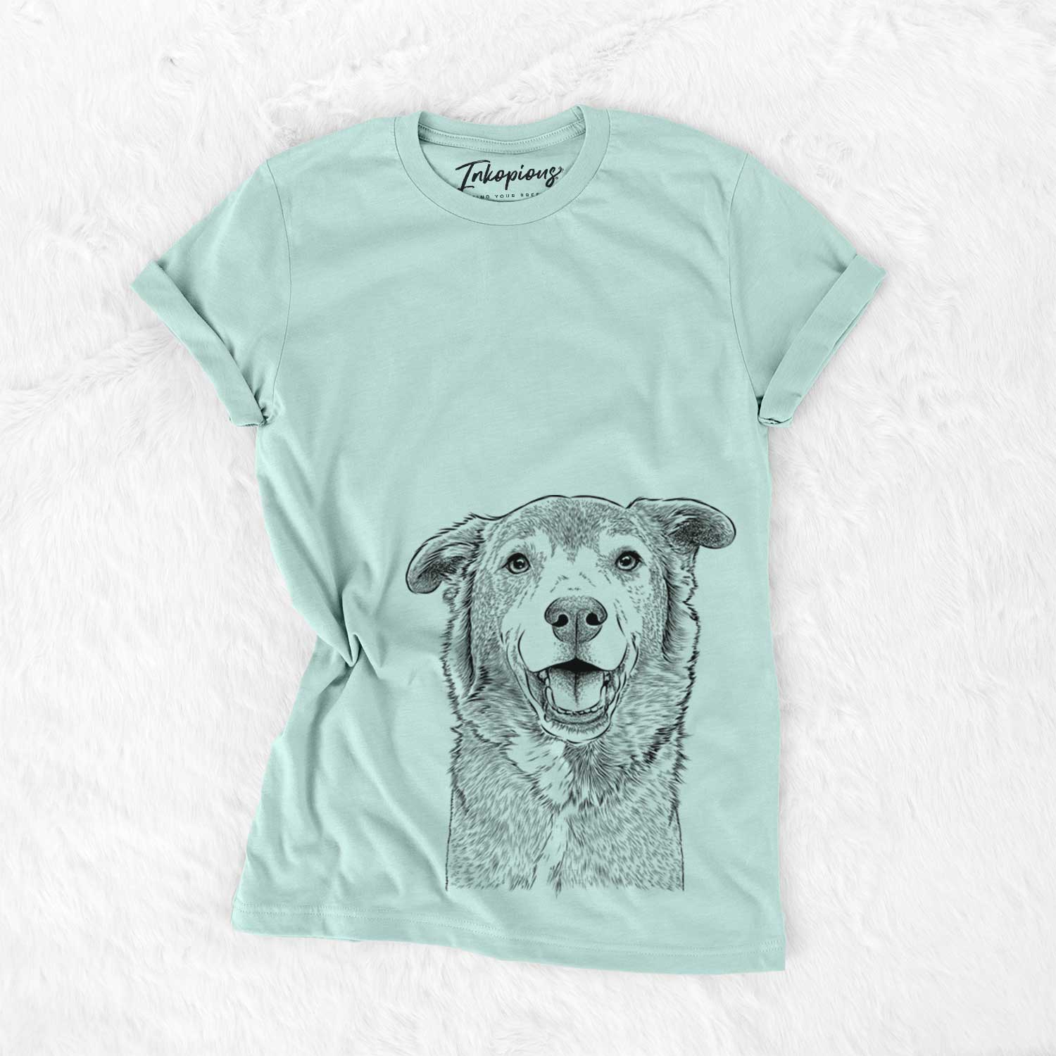 Hand-drawn sketch of Logan the Rescue Mutt on a Heather Sage Unisex crewneck