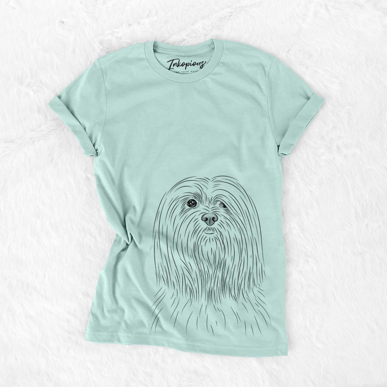 Hand-drawn sketch of Lorenzo the Lhasa Apso on a Heather Sage Unisex crewneck