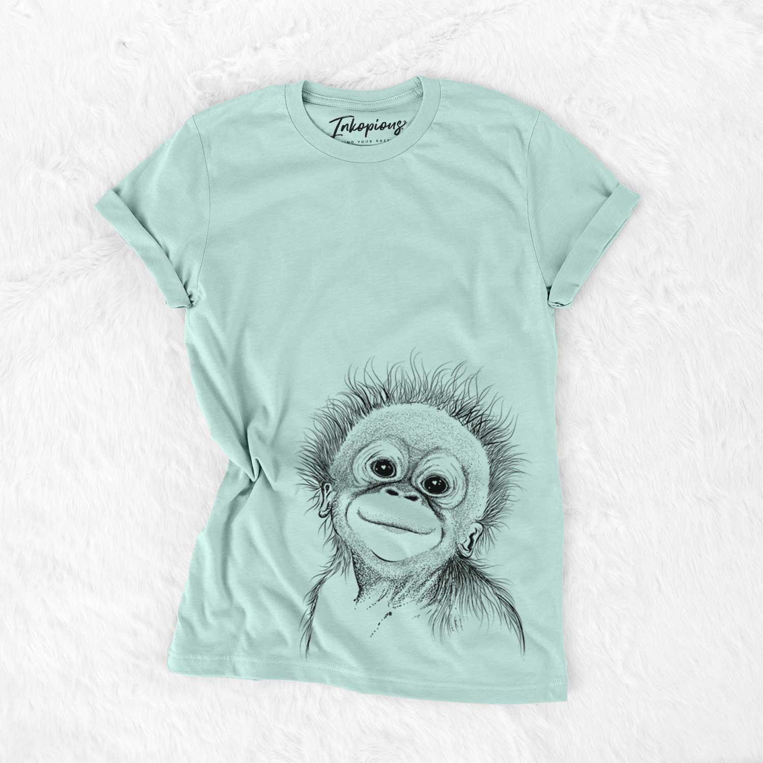 Hand-drawn sketch of Louie the Baby Orangutan on a Heather Sage Bella Canvas Unisex Crewneck