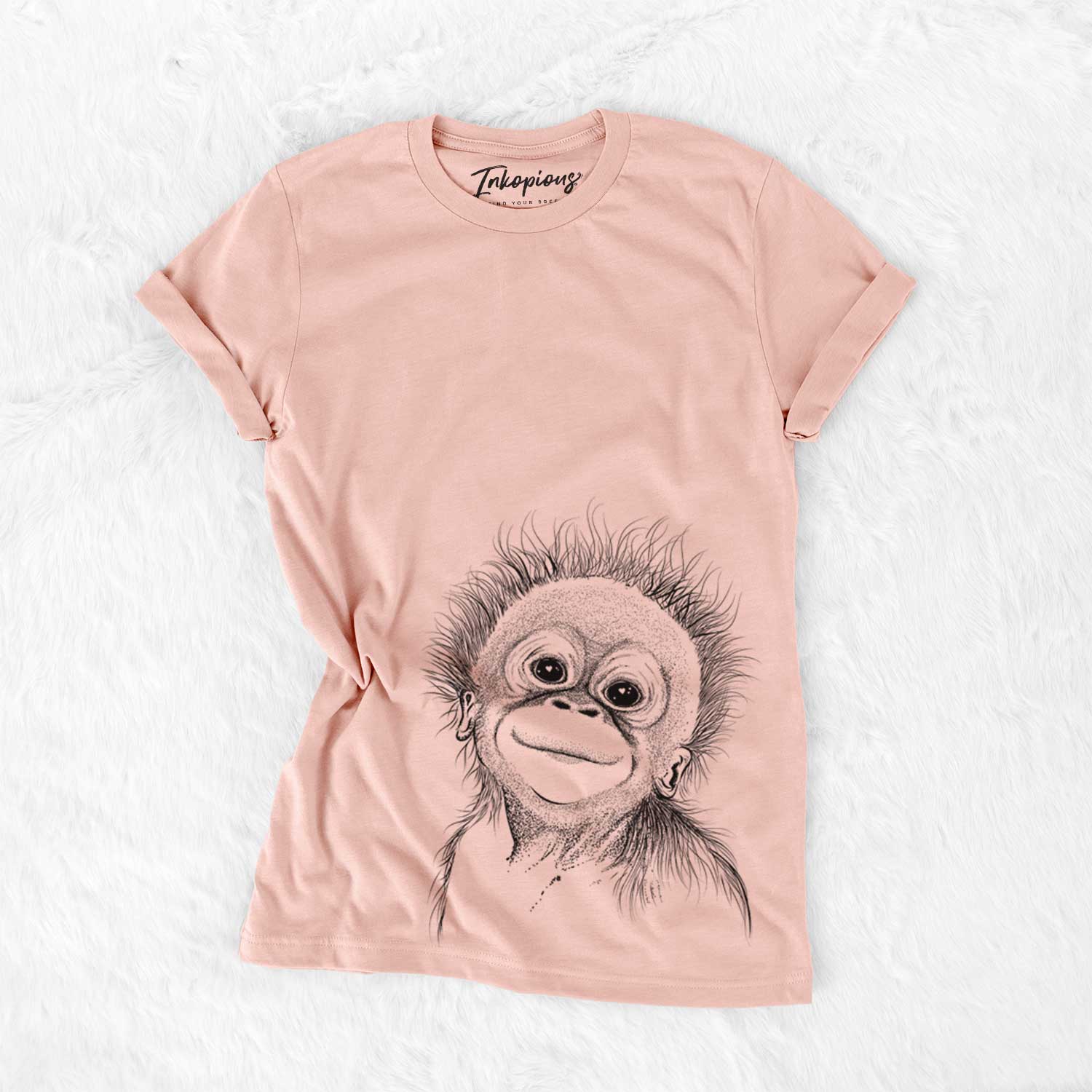 Hand-drawn sketch of Louie the Baby Orangutan on a Peach Bella Canvas Unisex Crewneck