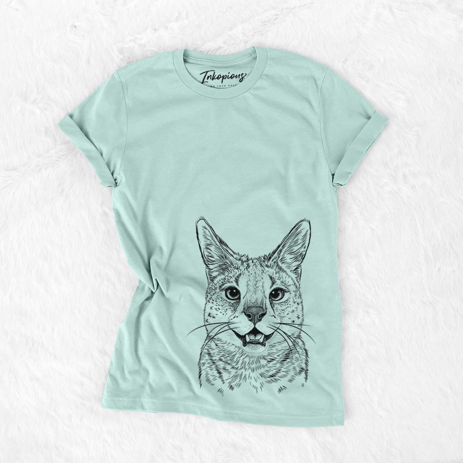 Hand-drawn sketch of Lucky the Serval Cat on a Heather Sage Unisex crewneck