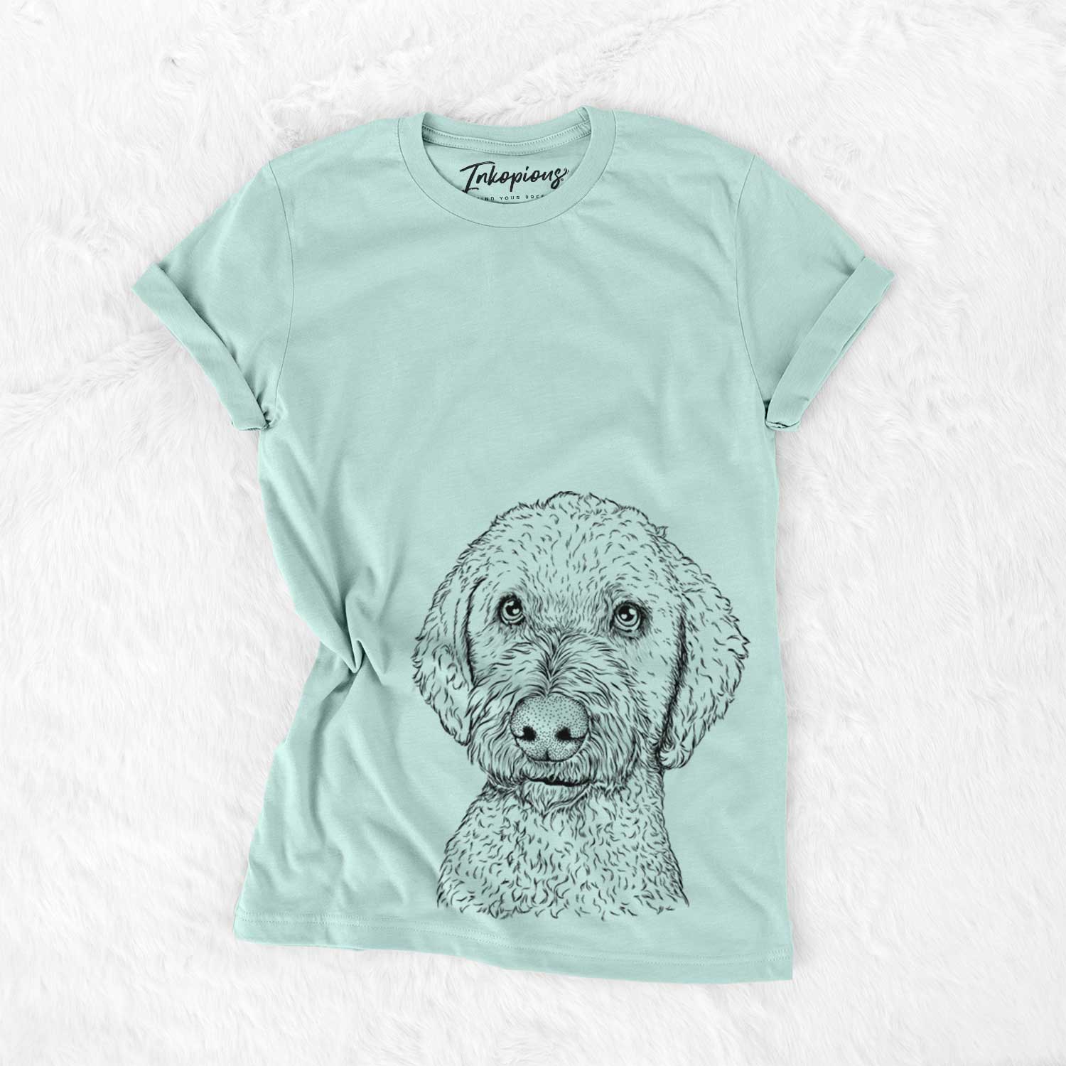 Hand-drawn sketch of Lucy Boo the Goldendoodle on a Heather Sage Unisex crewneck