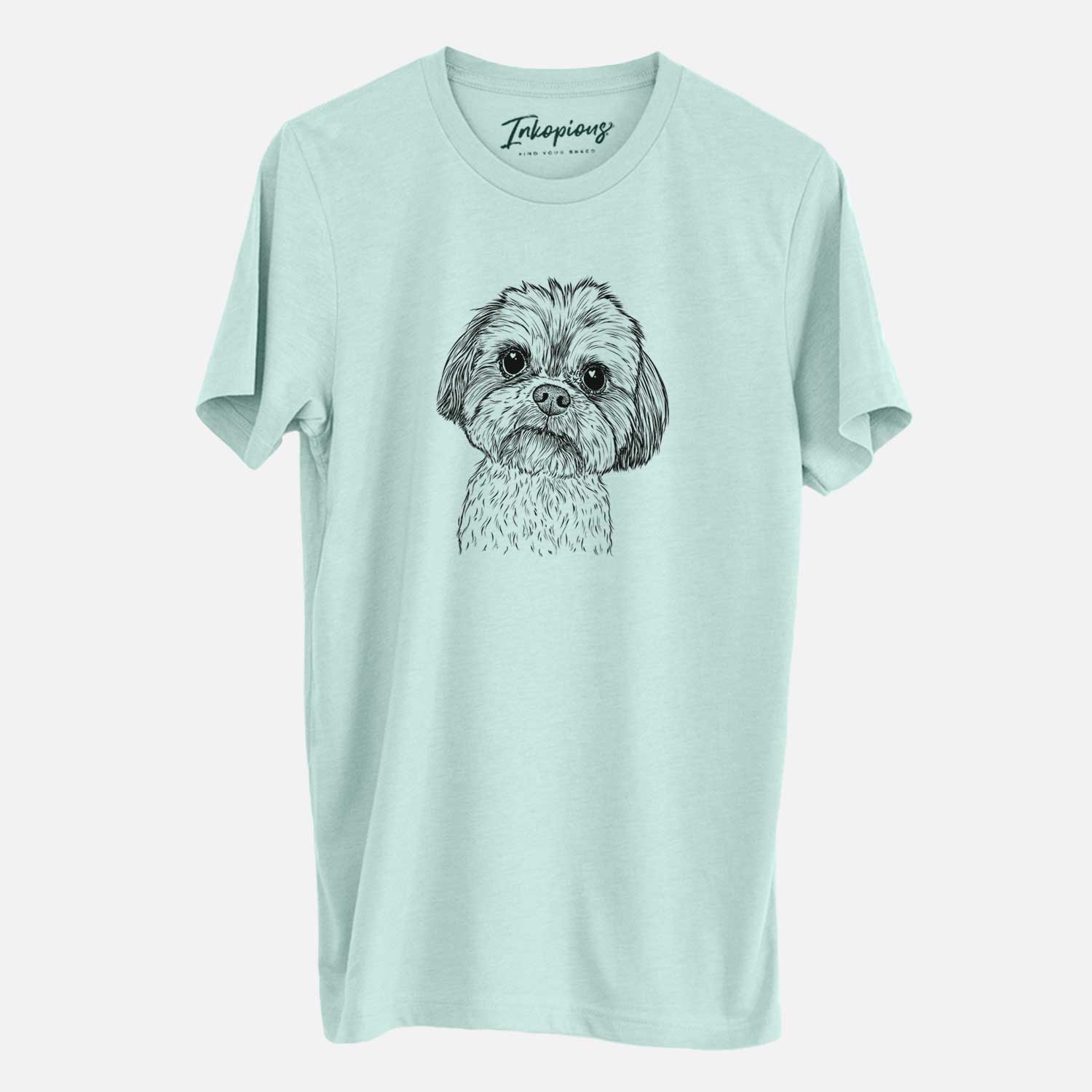 Hand-drawn sketch of Lucy the Shorkie on a Heather Sage Unisex crewneck