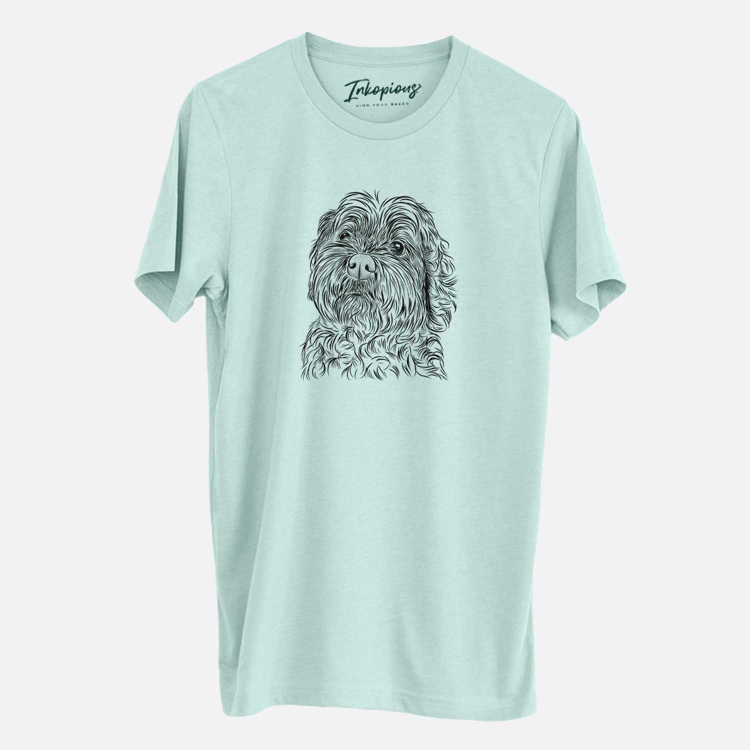 Hand-drawn sketch of Maggie Girl the Cockapoo on a Heather Sage Unisex crewneck