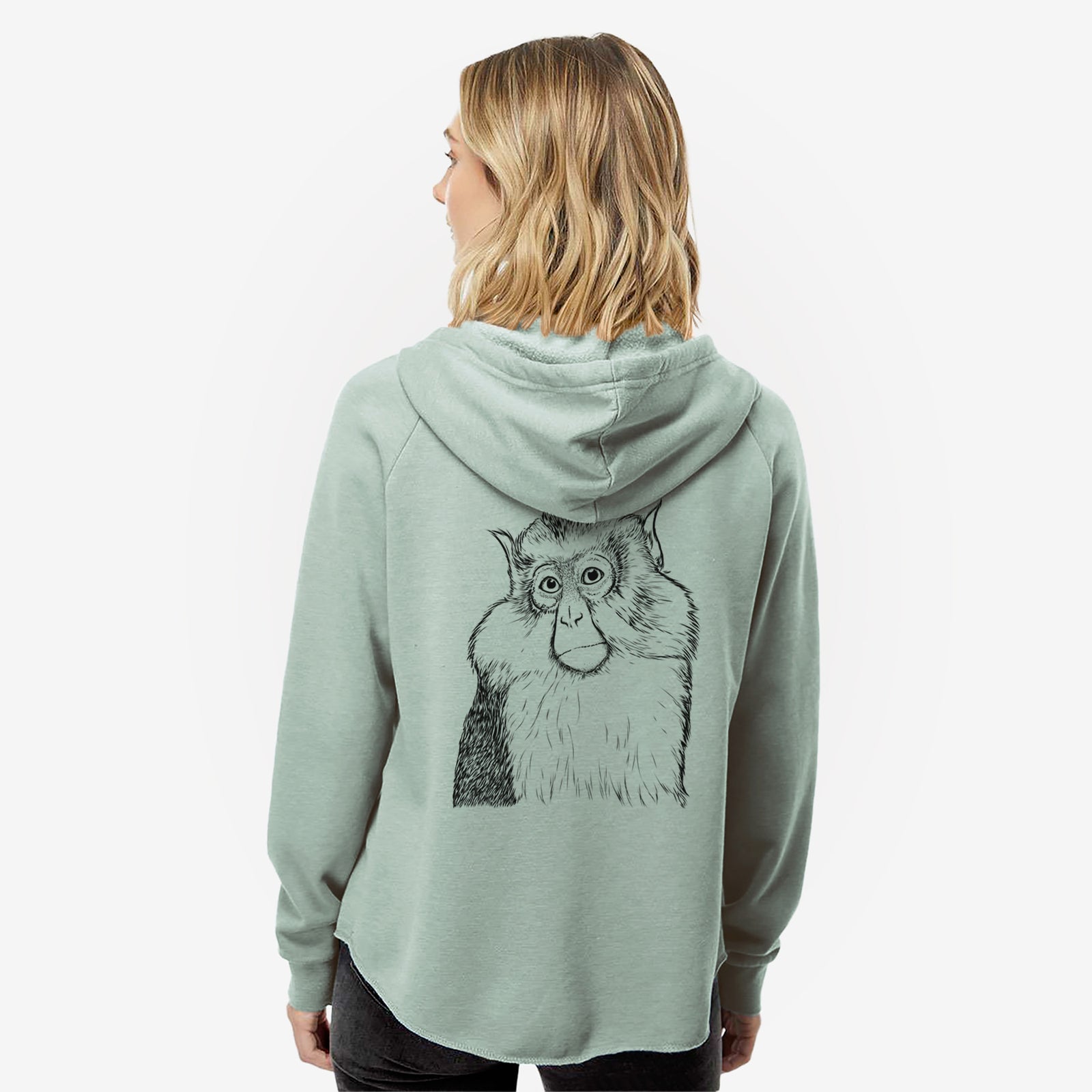 Hand-drawn sketch of Matata the Mona Monkey on a Sage Women's cali wave zip-up sweatshirt