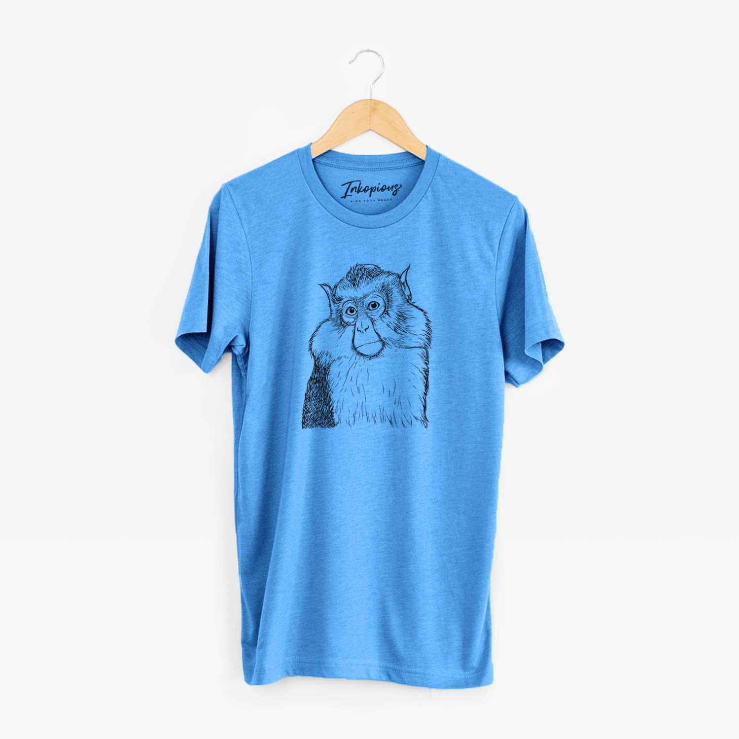 Hand-drawn sketch of Matata the Mona Monkey on a Blue Unisex crewneck