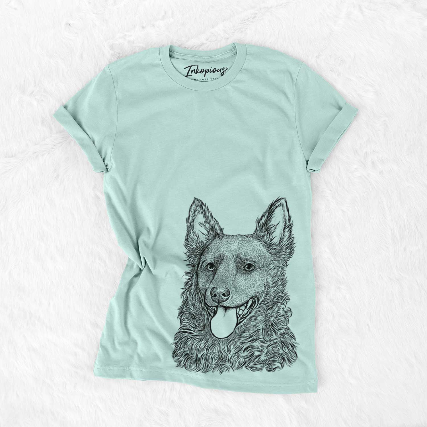 Hand-drawn sketch of Maximo the Mudi on a Heather Sage Unisex crewneck