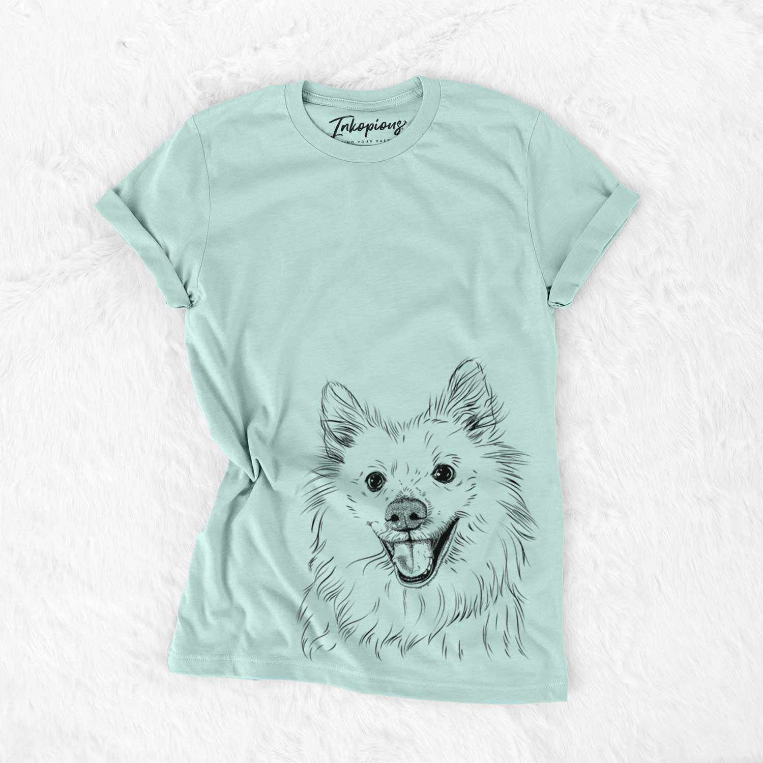 Hand-drawn sketch of Miki the American Eskimo on a Heather Sage Unisex crewneck