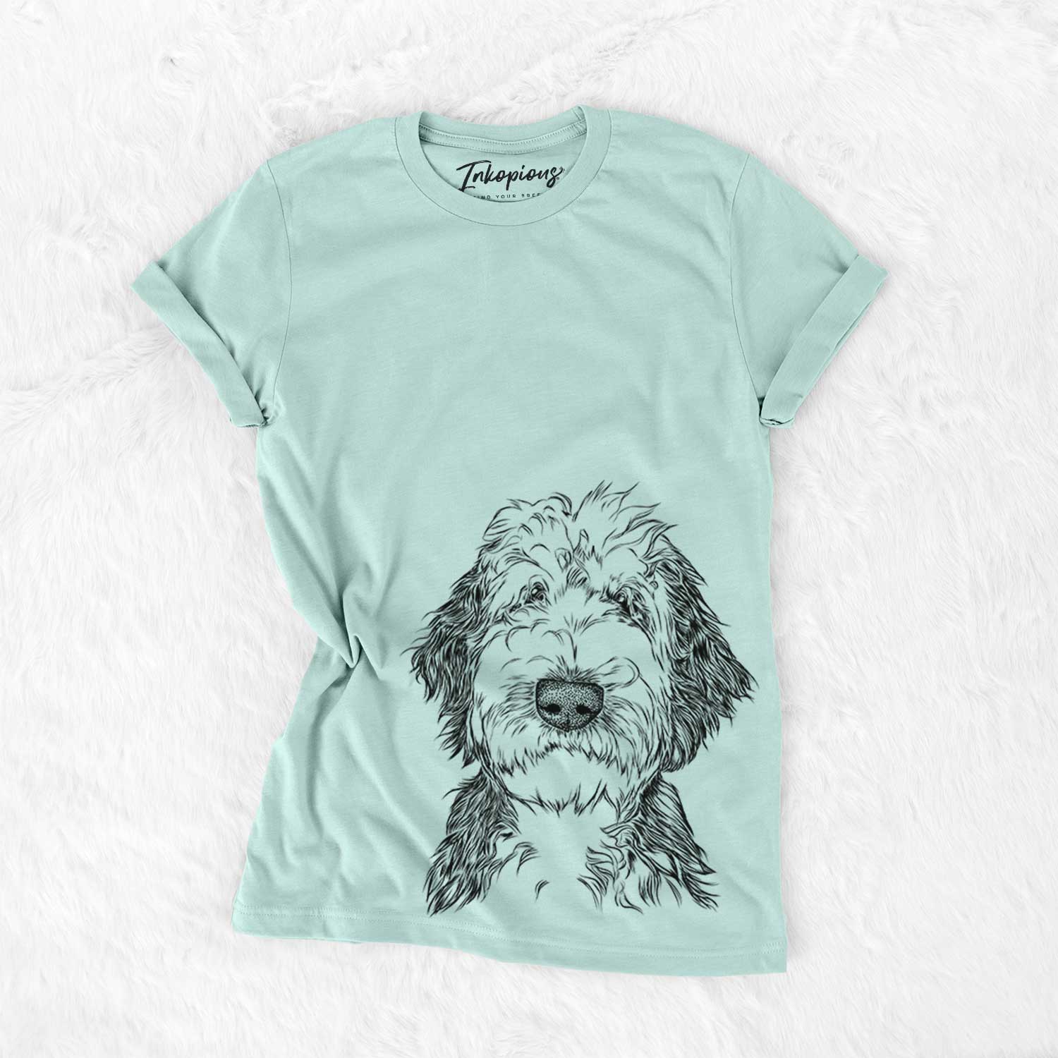 Hand-drawn sketch of Milo Fluff the Sheepadoodle on a Heather Sage Bella Canvas Unisex Crewneck