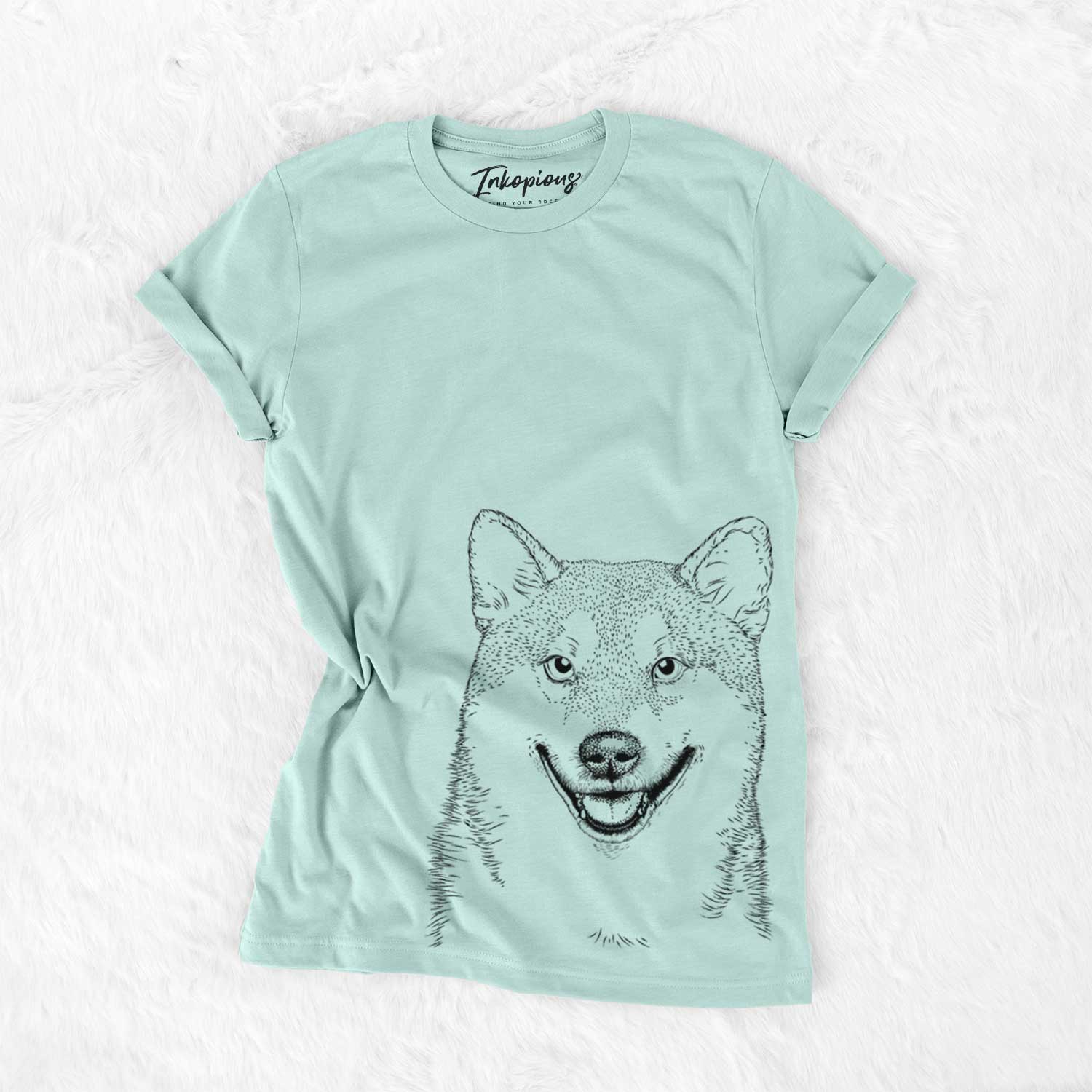 Hand-drawn sketch of Mitsu the Shiba Inu on a Heather Sage Unisex crewneck