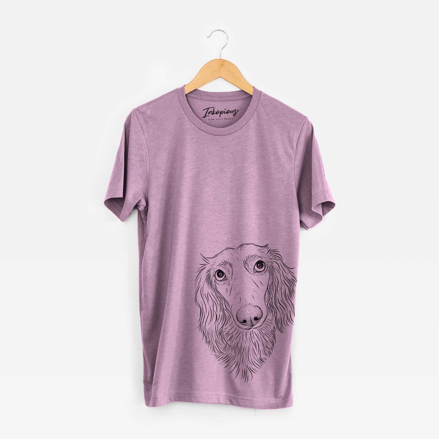 Hand-drawn sketch of Mr. Rusty the Long Haired Dachshund on an Orchid Bella Canvas Unisex Crewneck