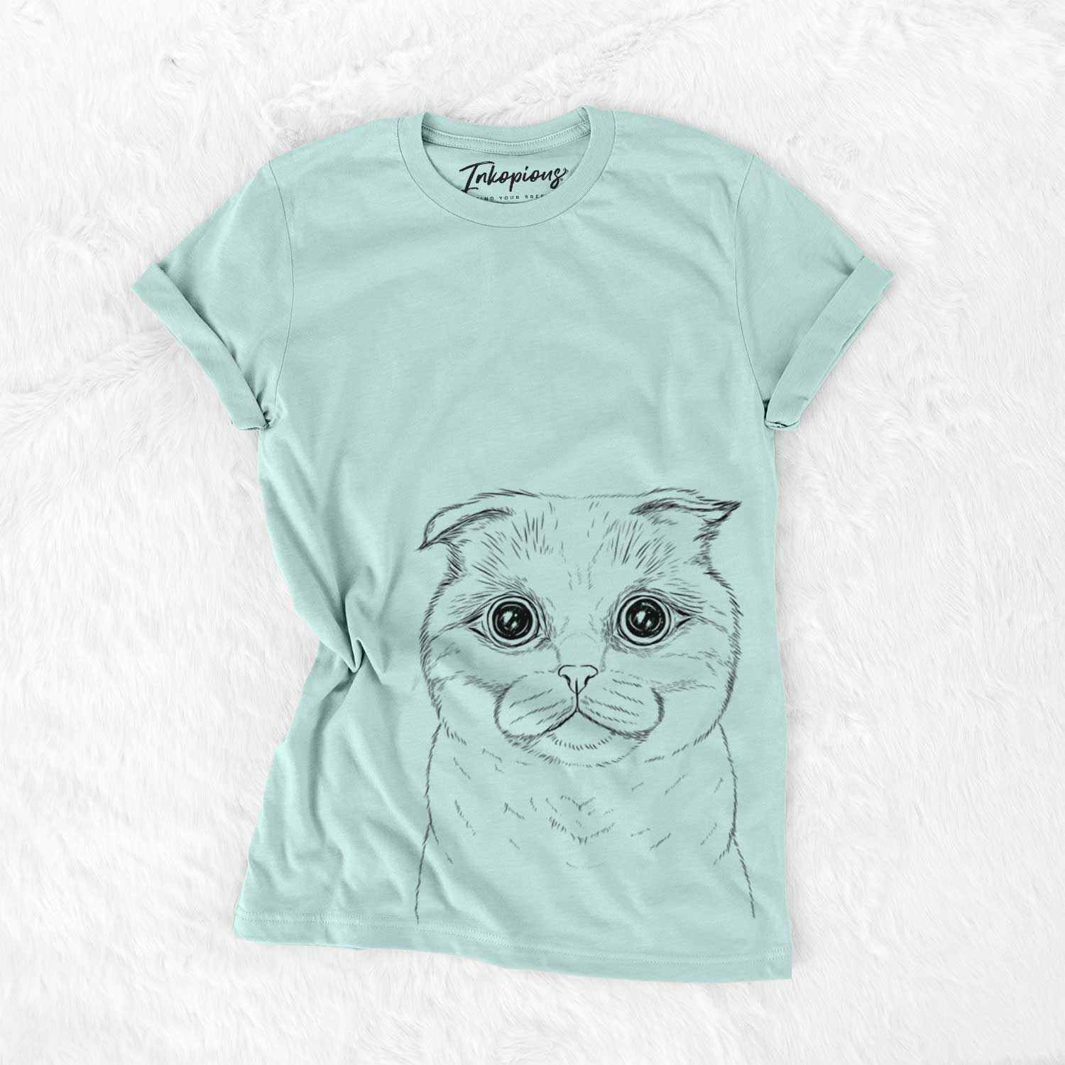 Hand-drawn sketch of Neko the Scottish Fold Cat on a Heather Sage Unisex crewneck