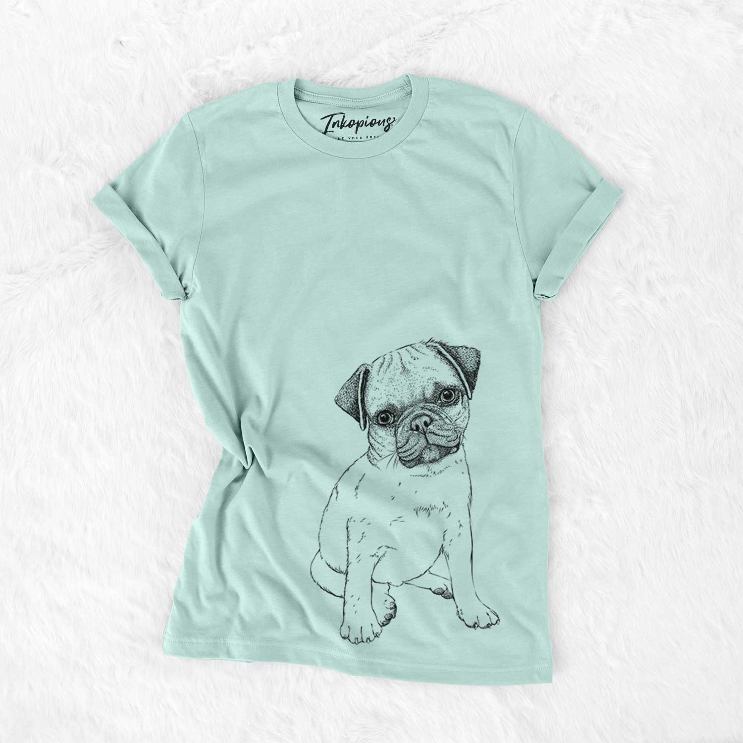 Hand-drawn sketch of Nelson the Pug Puppy on a Heather Sage Bella Canvas Unisex Crewneck