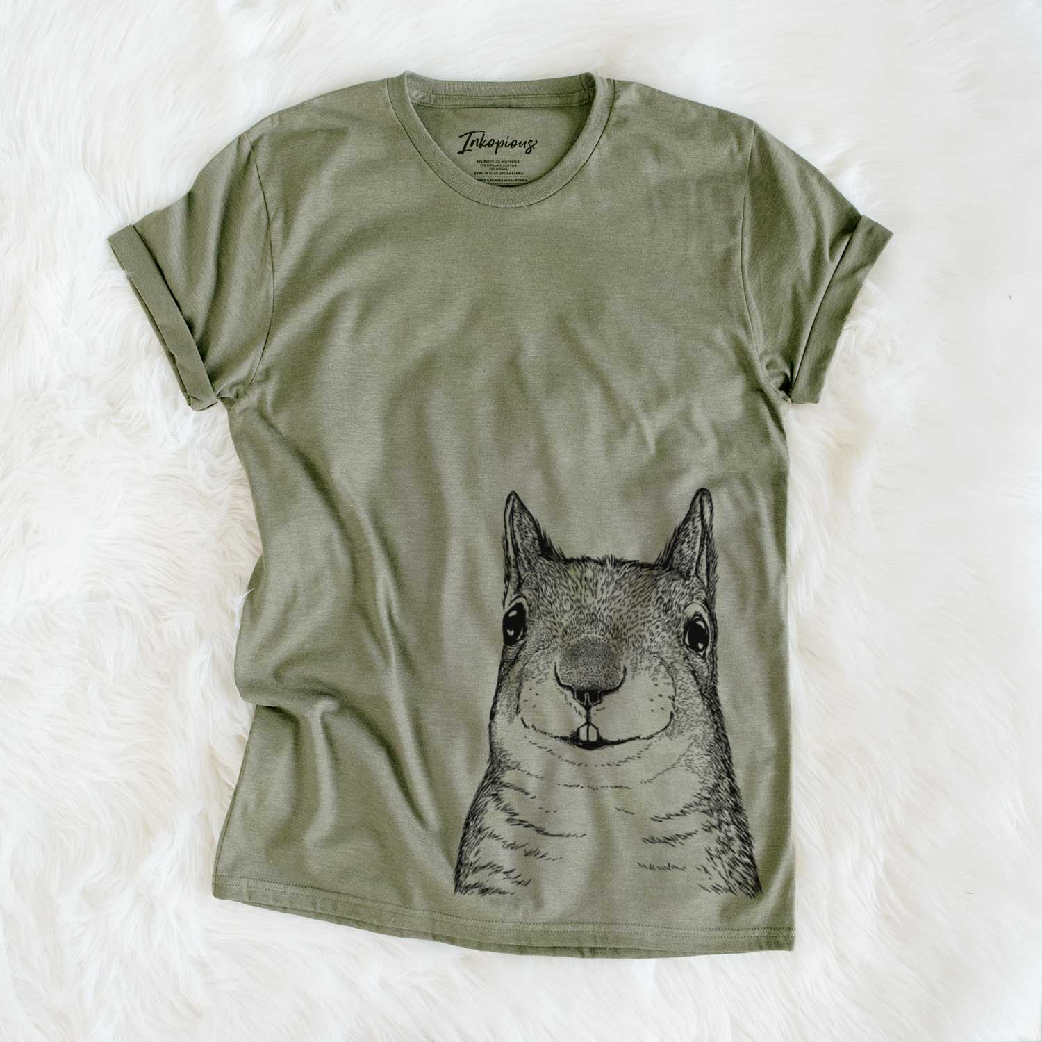 Hand-drawn sketch of Nibbles the Squirrel on an Olive Unisex crewneck