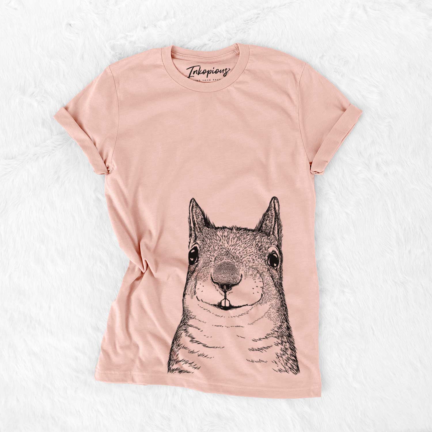 Hand-drawn sketch of Nibbles the Squirrel on a Peach Bella Canvas Unisex Crewneck