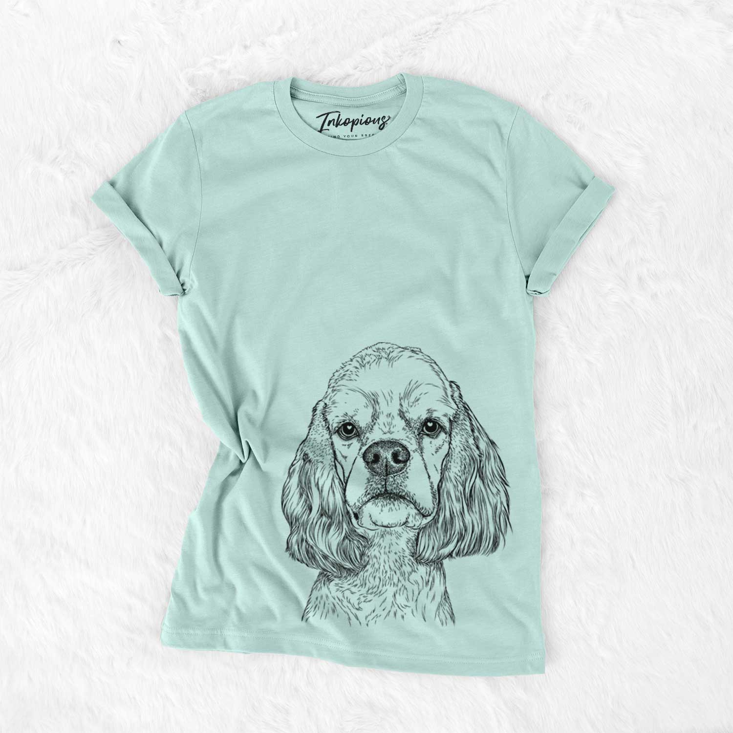 Hand-drawn sketch of Oakley the American Cocker Spaniel on a Heather Sage Bella Canvas Unisex Crewneck
