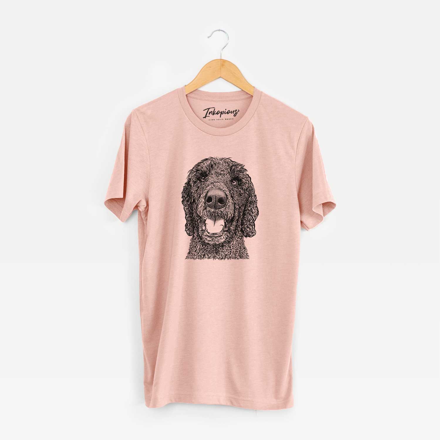 Hand-drawn sketch of Obi James the Goldendoodle on a Peach Unisex crewneck