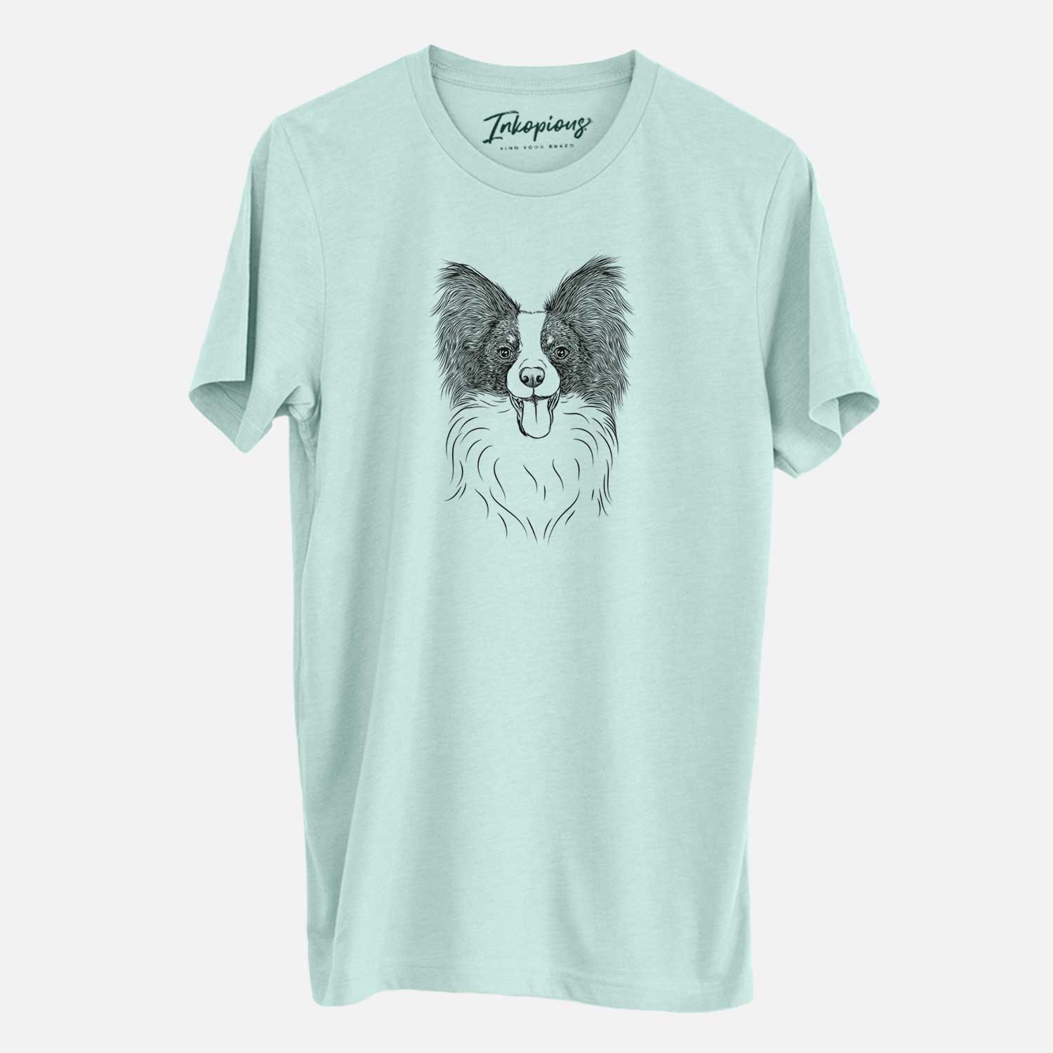 Hand-drawn sketch of Patrick the Papillon on a Heather Sage Unisex crewneck