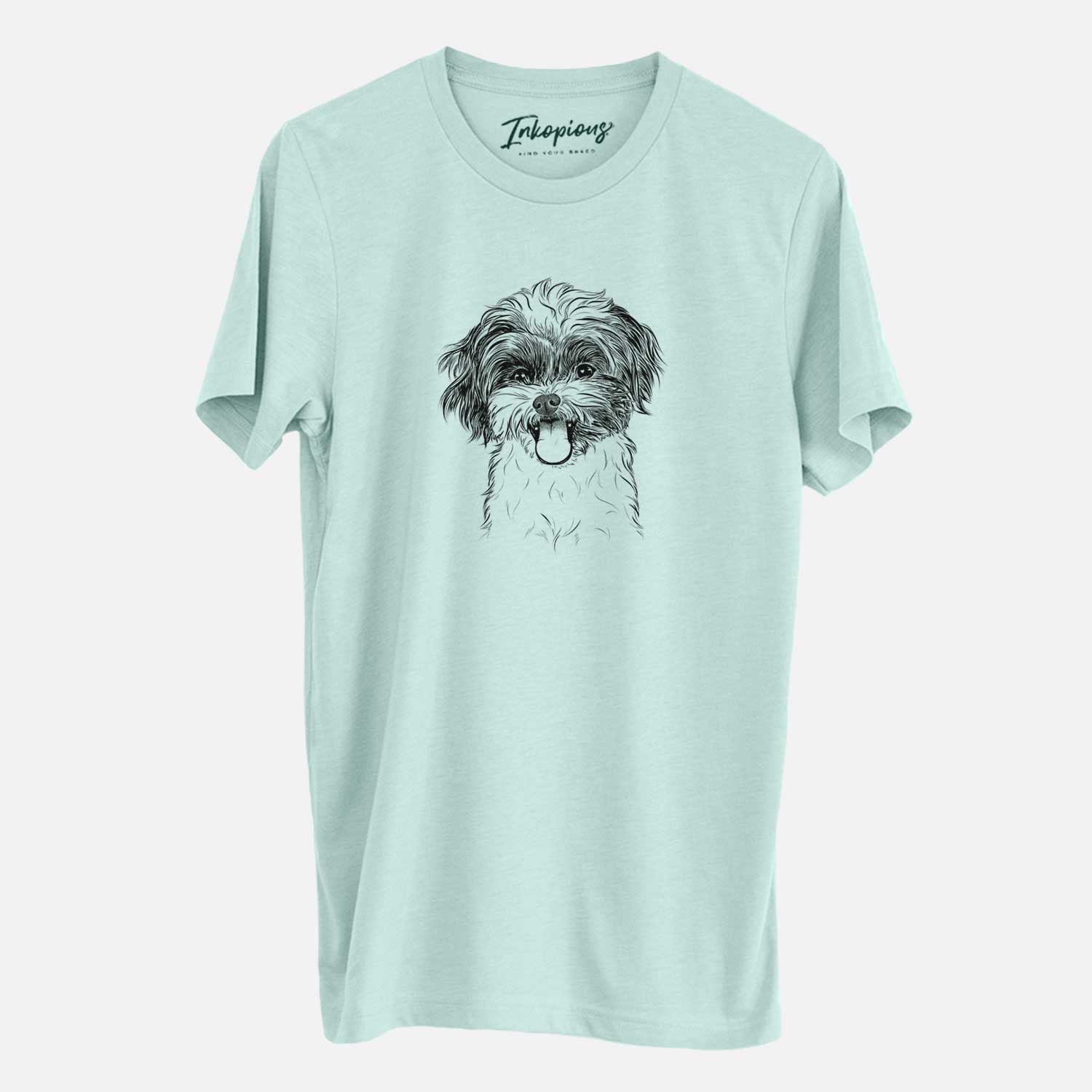 Hand-drawn sketch of Pepper the Shihpoo on a Heather Sage Unisex crewneck