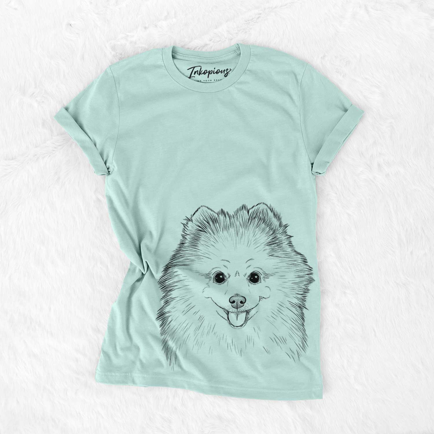 Hand-drawn sketch of Piper Jo the Pomeranian on a Heather Sage Unisex crewneck