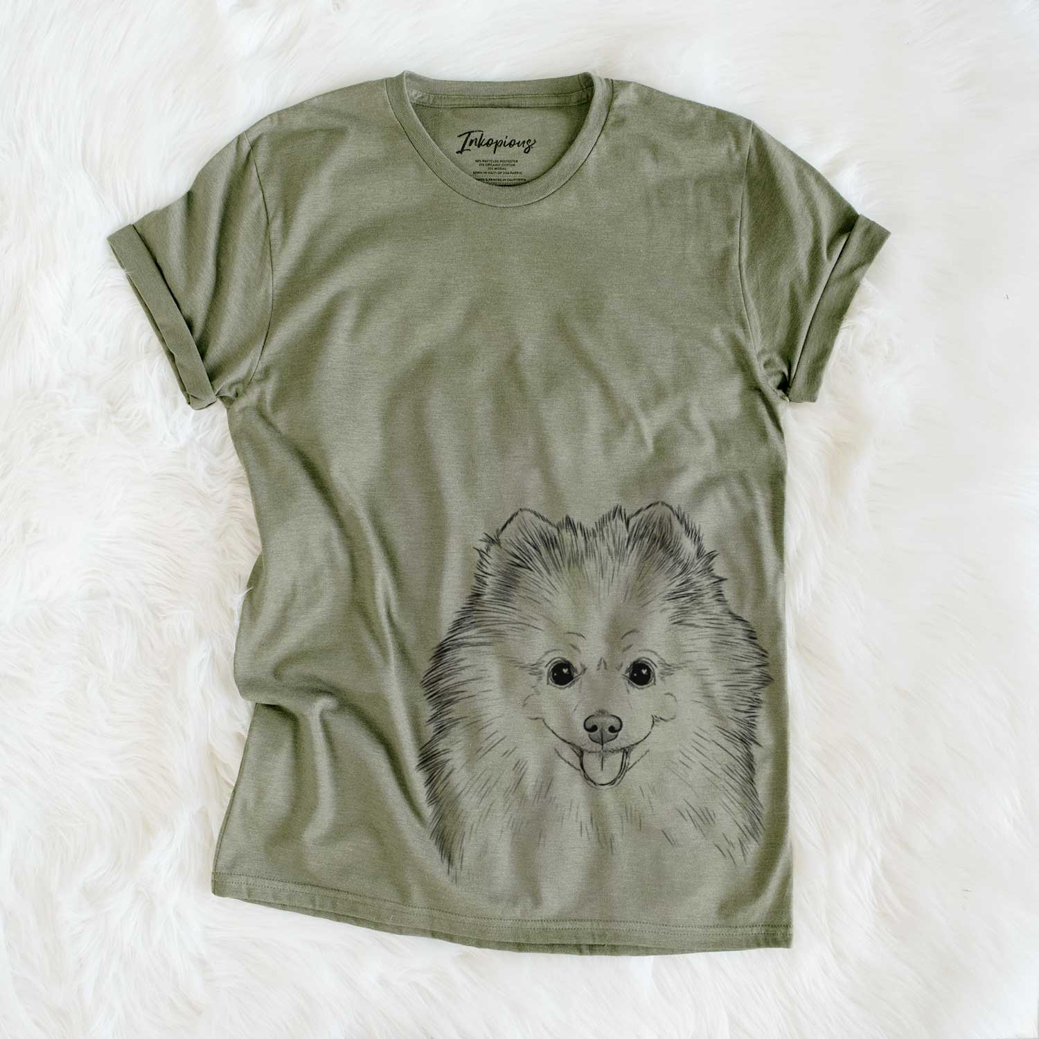 Hand-drawn sketch of Piper Jo the Pomeranian on an Olive Unisex crewneck