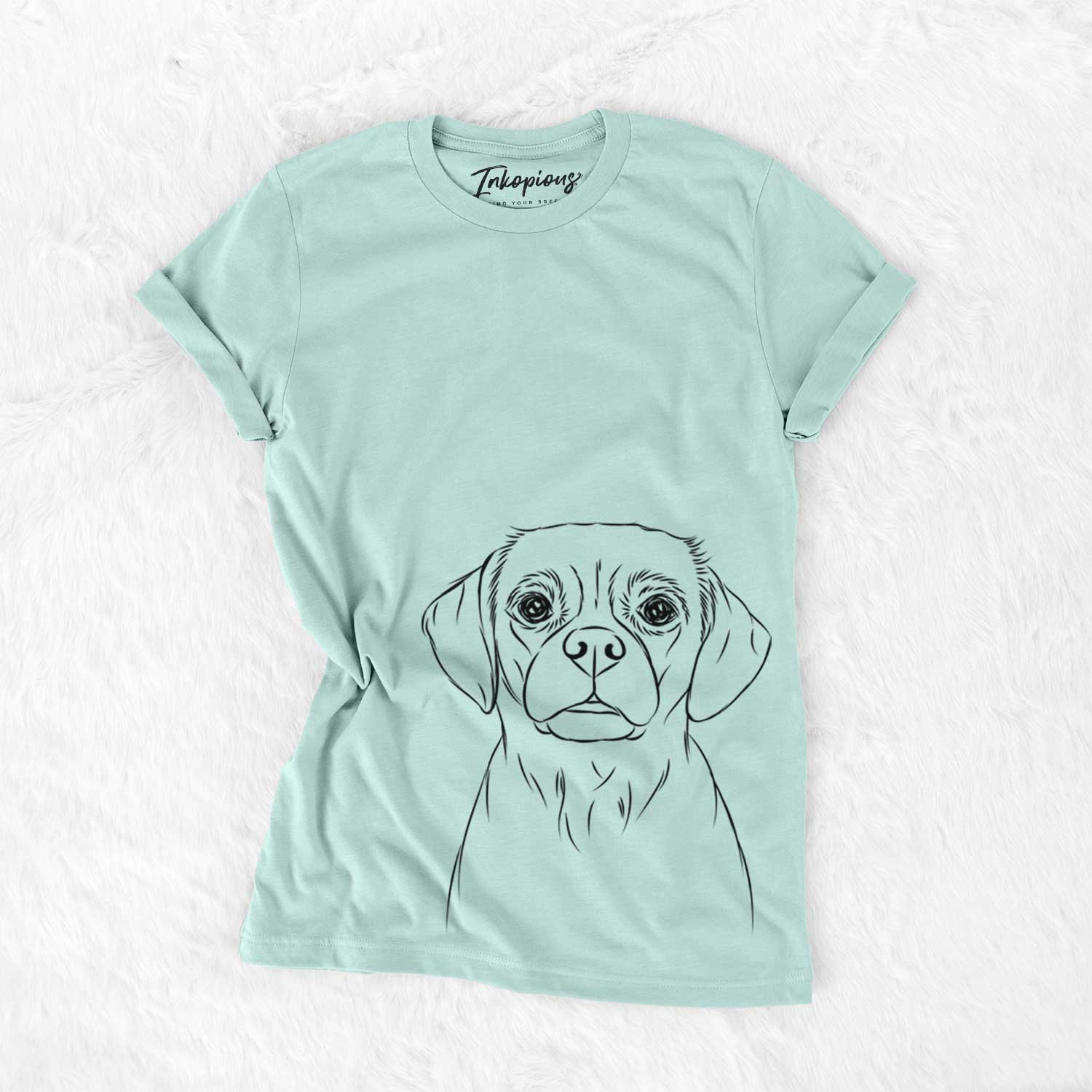 Hand-drawn sketch of Popcorn the Puggle on a Heather Sage Unisex crewneck