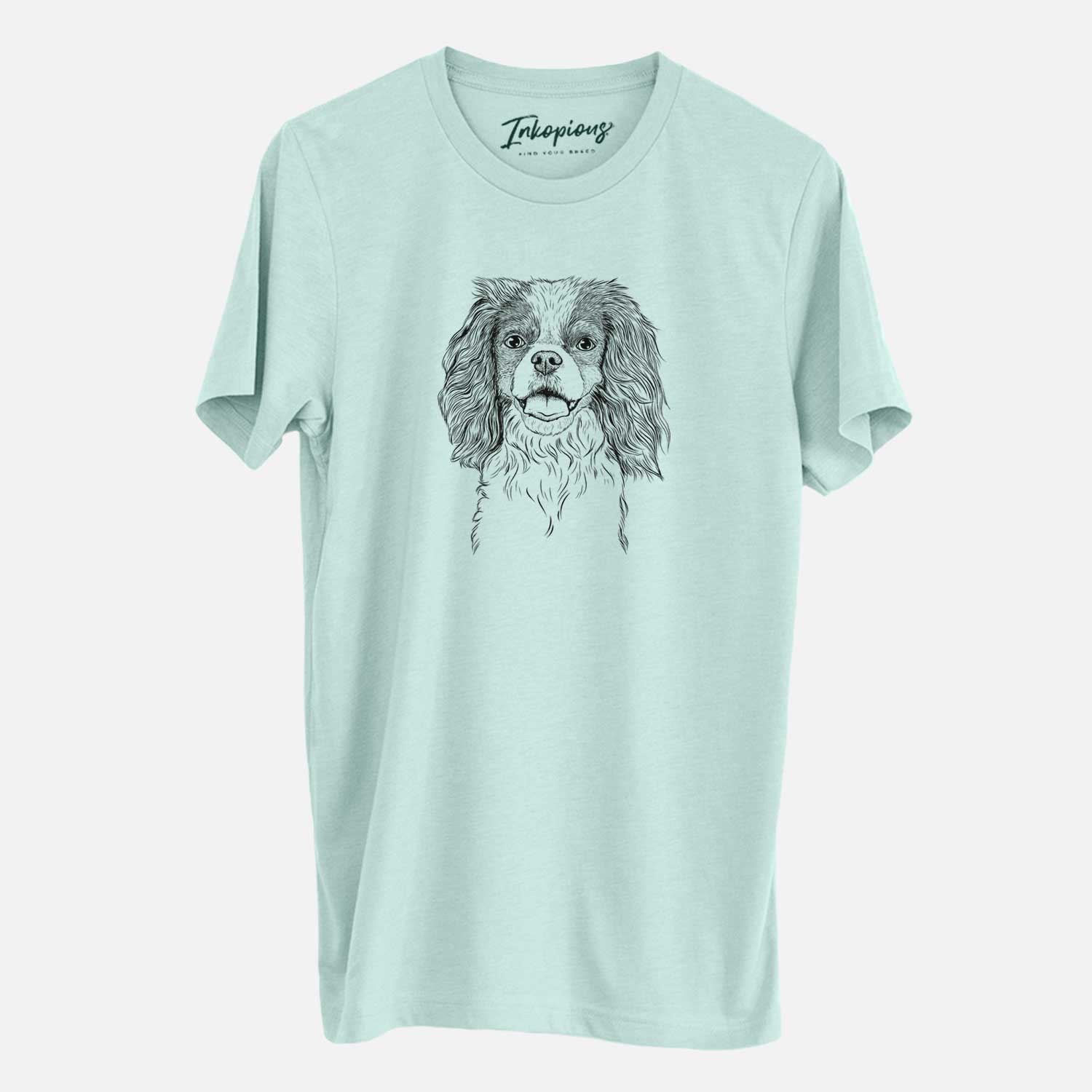 Hand-drawn sketch of Poppy the Cavalier King Charles Spaniel on a Heather Sage Unisex crewneck