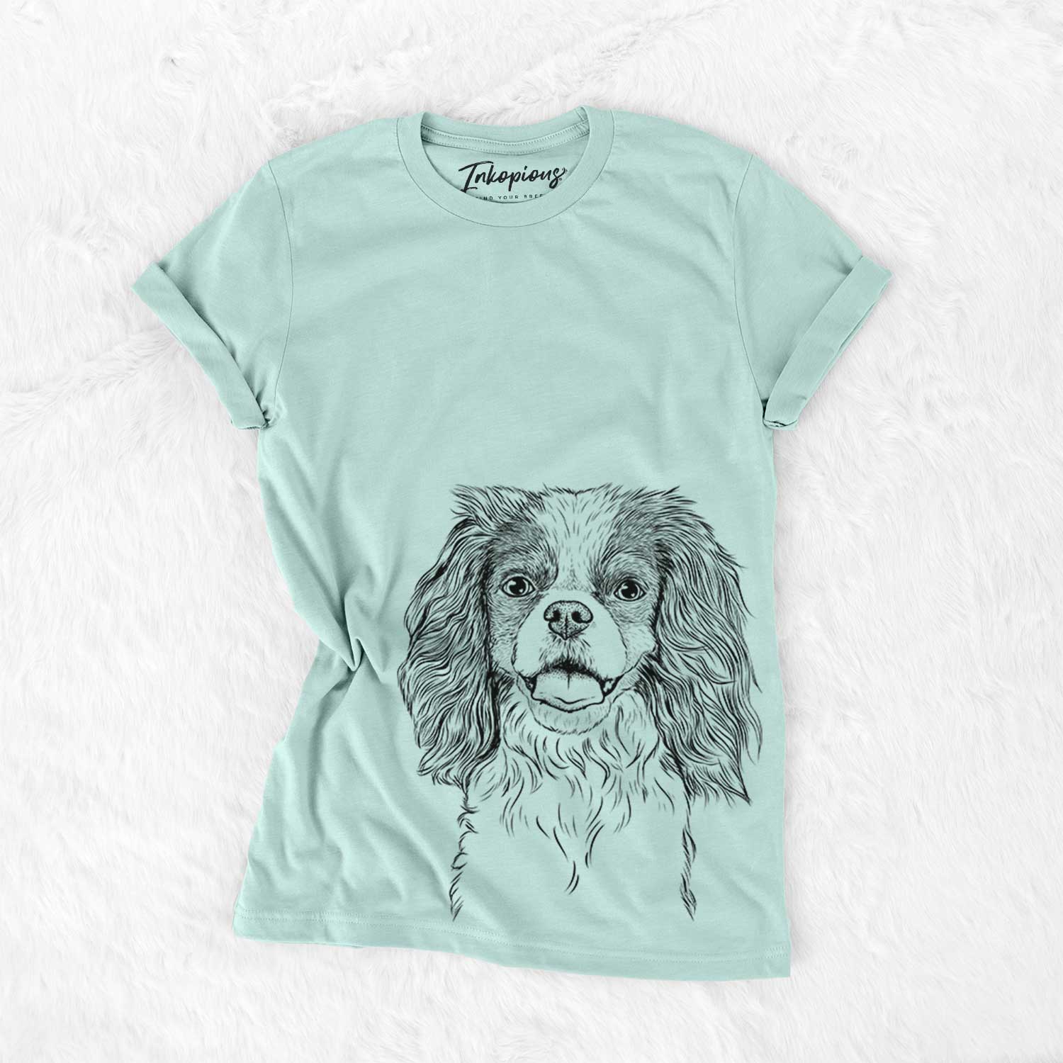 Hand-drawn sketch of Poppy the Cavalier King Charles Spaniel on a Heather Sage Bella Canvas Unisex Crewneck