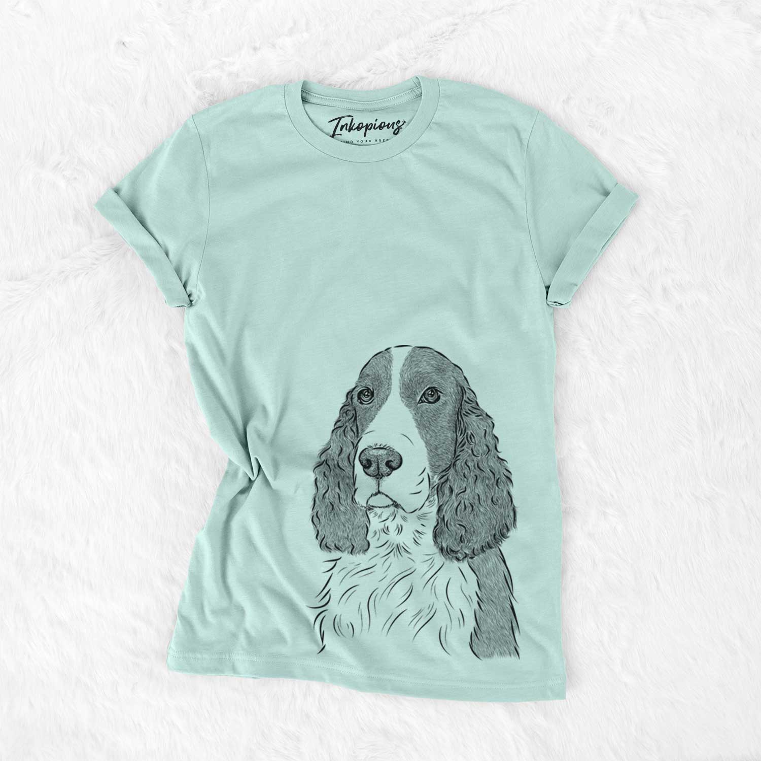 Hand-drawn sketch of Quincy the English Springer Spaniel on a Heather Sage Unisex crewneck