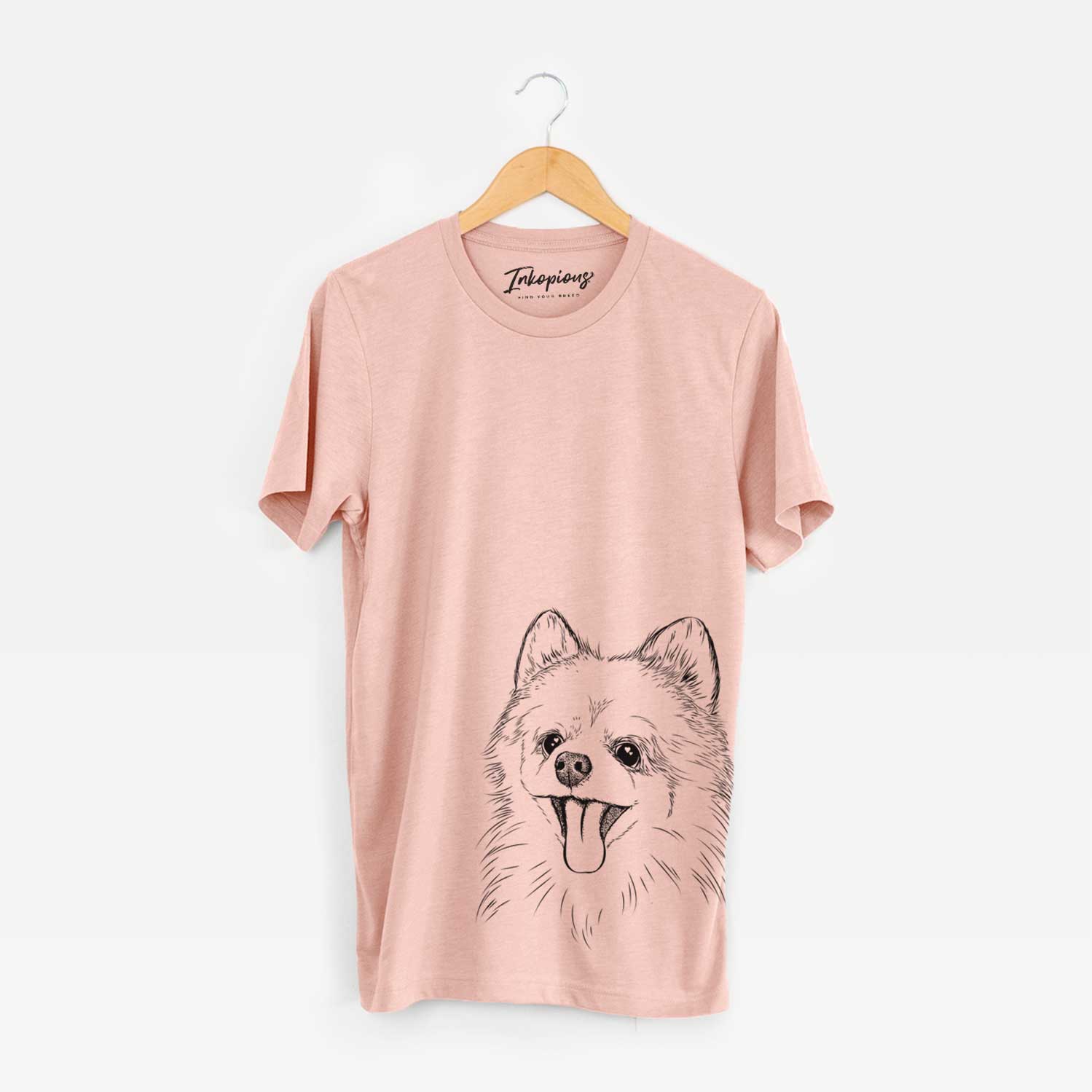 Hand-drawn sketch of Quinn the Pomeranian on a Peach Unisex crewneck