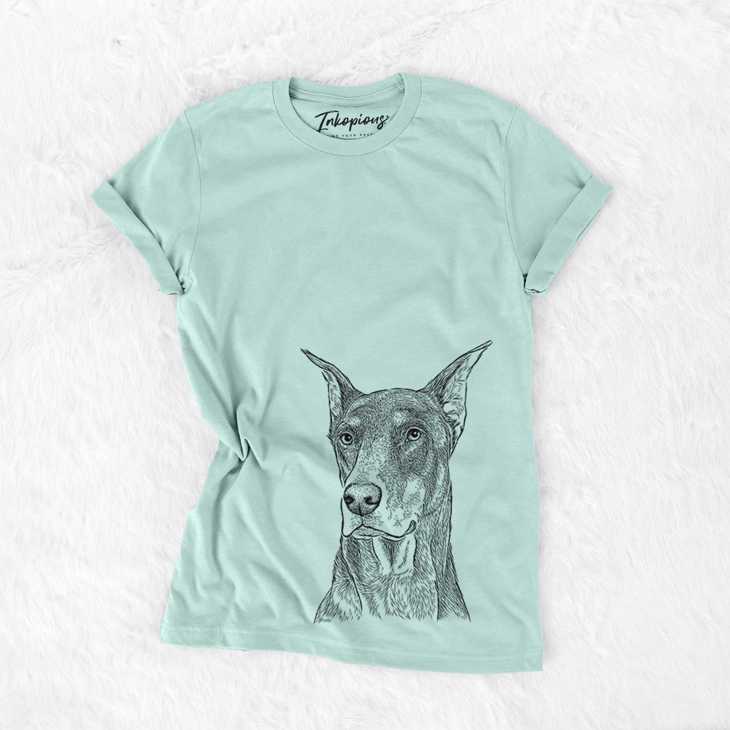 Hand-drawn sketch of RJ the Doberman Pinscher on a Heather Sage Unisex crewneck