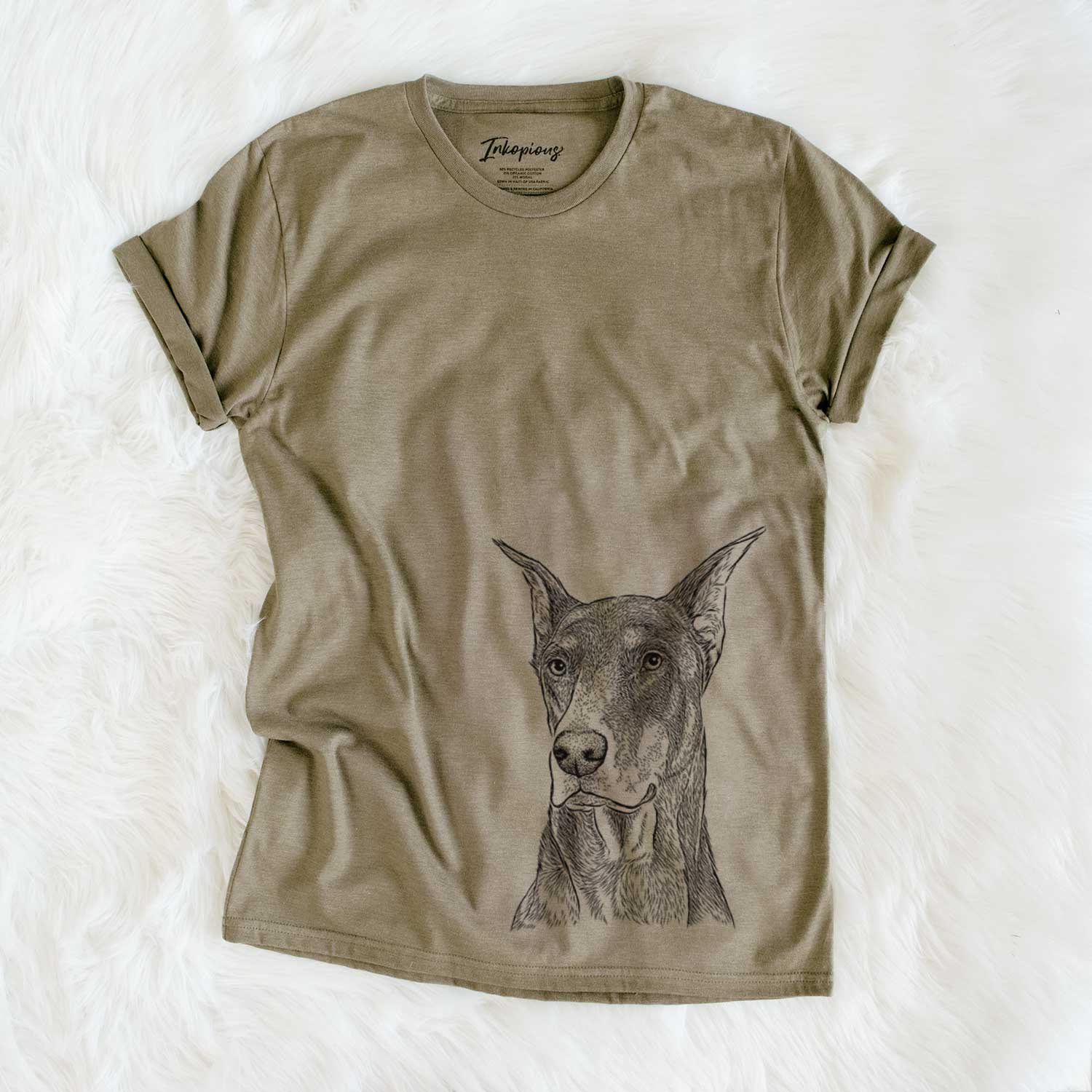 Hand-drawn sketch of RJ the Doberman Pinscher on an Olive Unisex crewneck