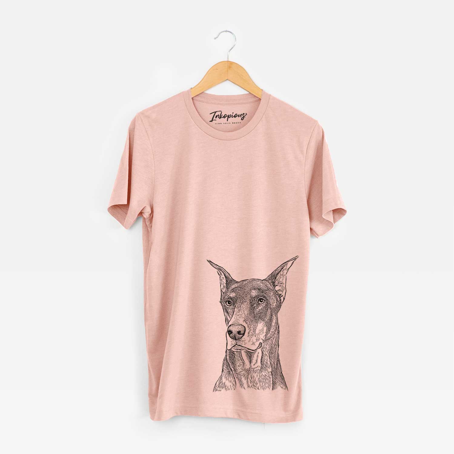 Hand-drawn sketch of RJ the Doberman Pinscher on a Peach Unisex crewneck
