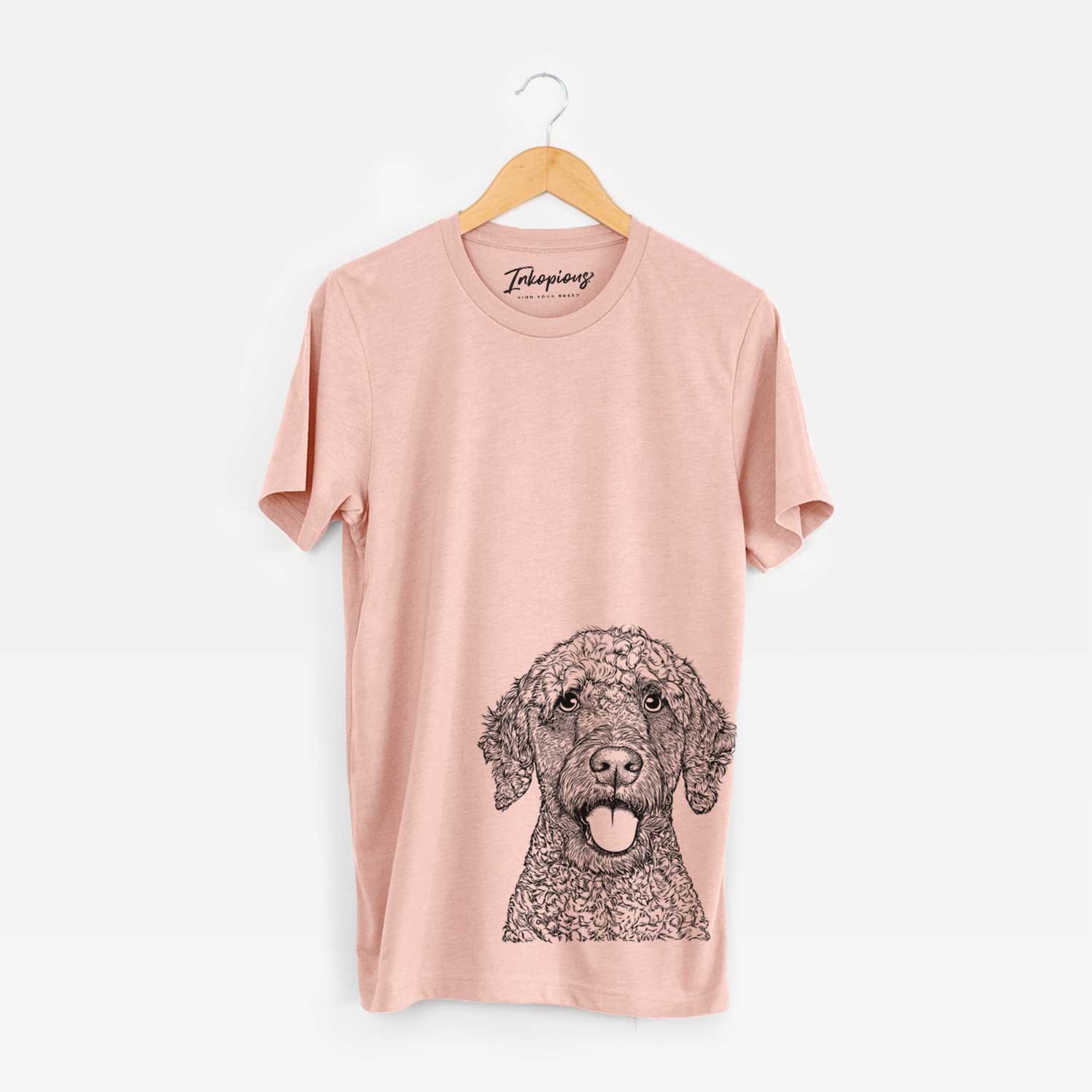 Hand-drawn sketch of Reina the Spanish Water Dog on a Peach Bella Canvas Unisex Crewneck