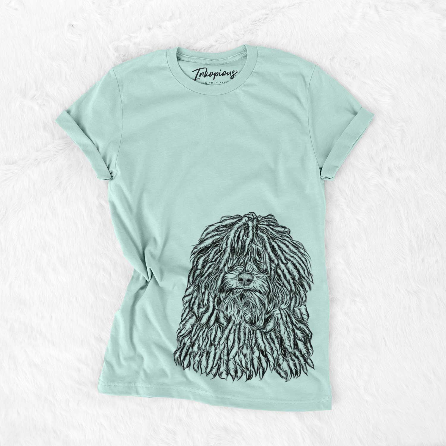 Hand-drawn sketch of Rezi the Puli on a Heather Sage Unisex crewneck