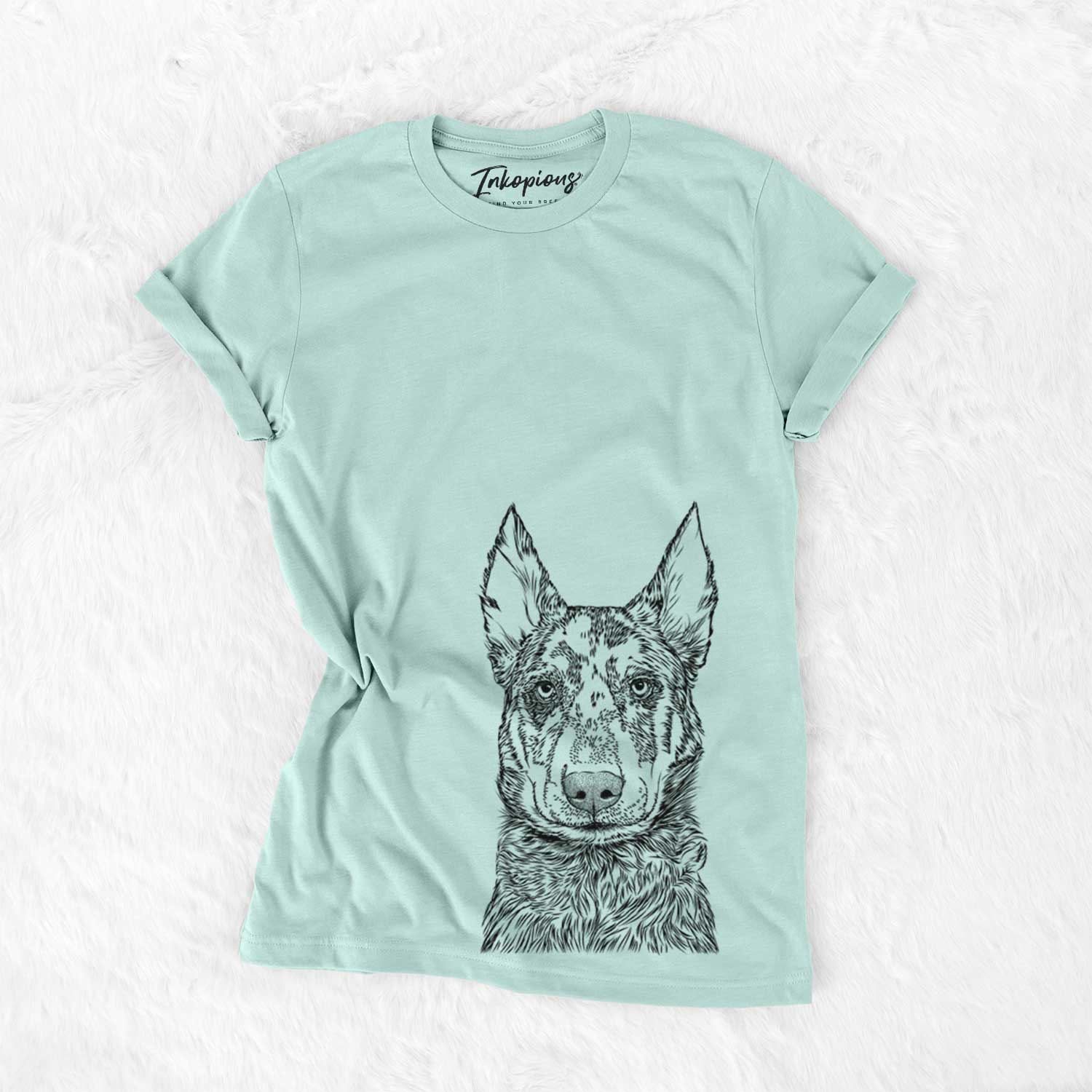 Hand-drawn sketch of Riggs the Beauceron on a Heather Sage Unisex crewneck