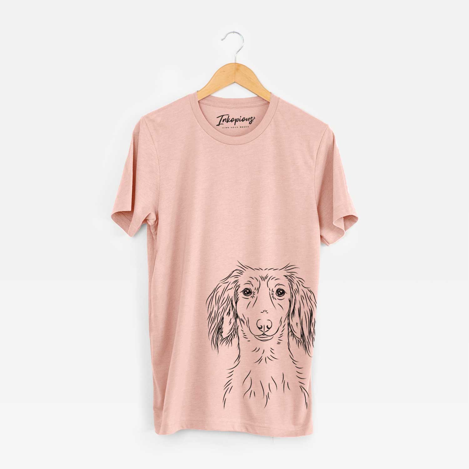 Hand-drawn sketch of Roux the Long Haired Dachshund on a Peach Bella Canvas Unisex Crewneck