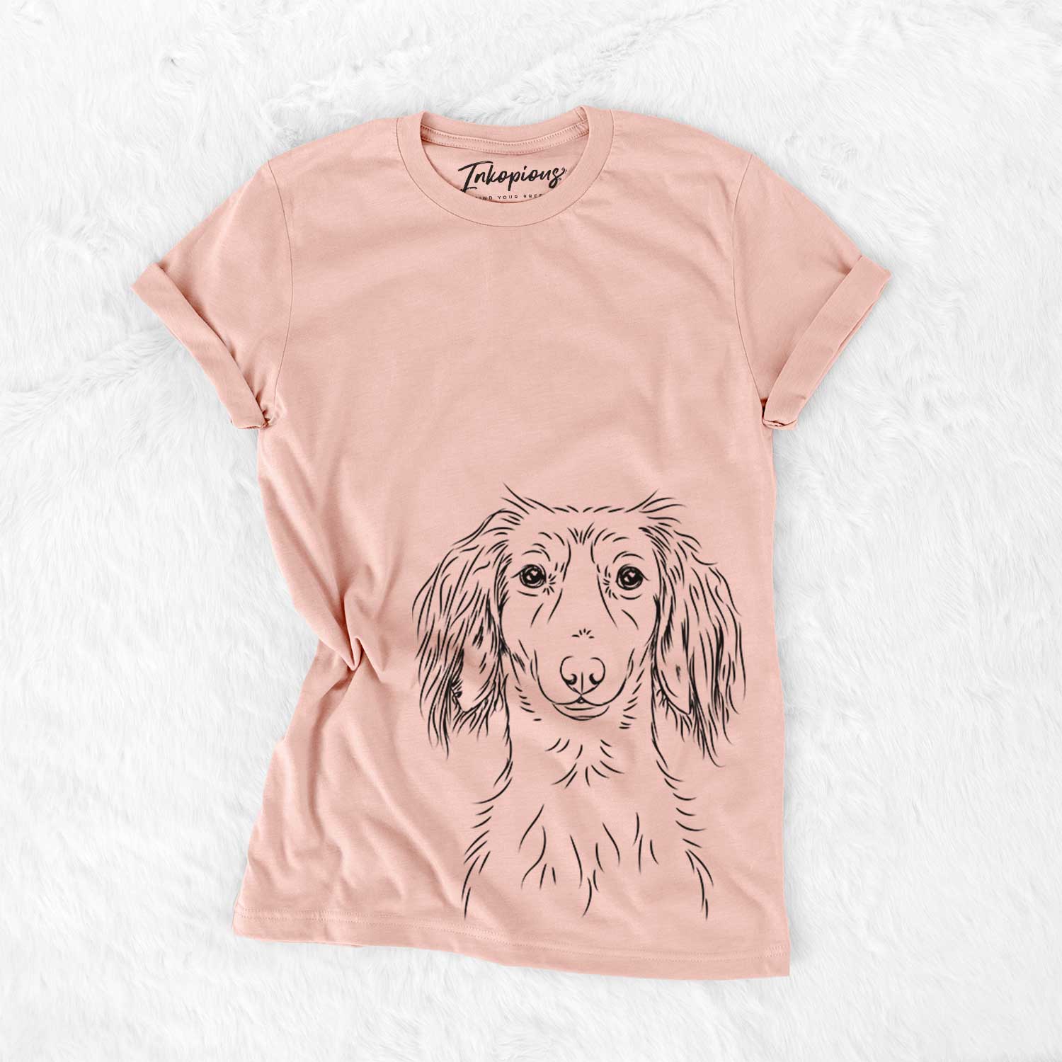 Hand-drawn sketch of Roux the Long Haired Dachshund on a Peach Bella Canvas Unisex Crewneck