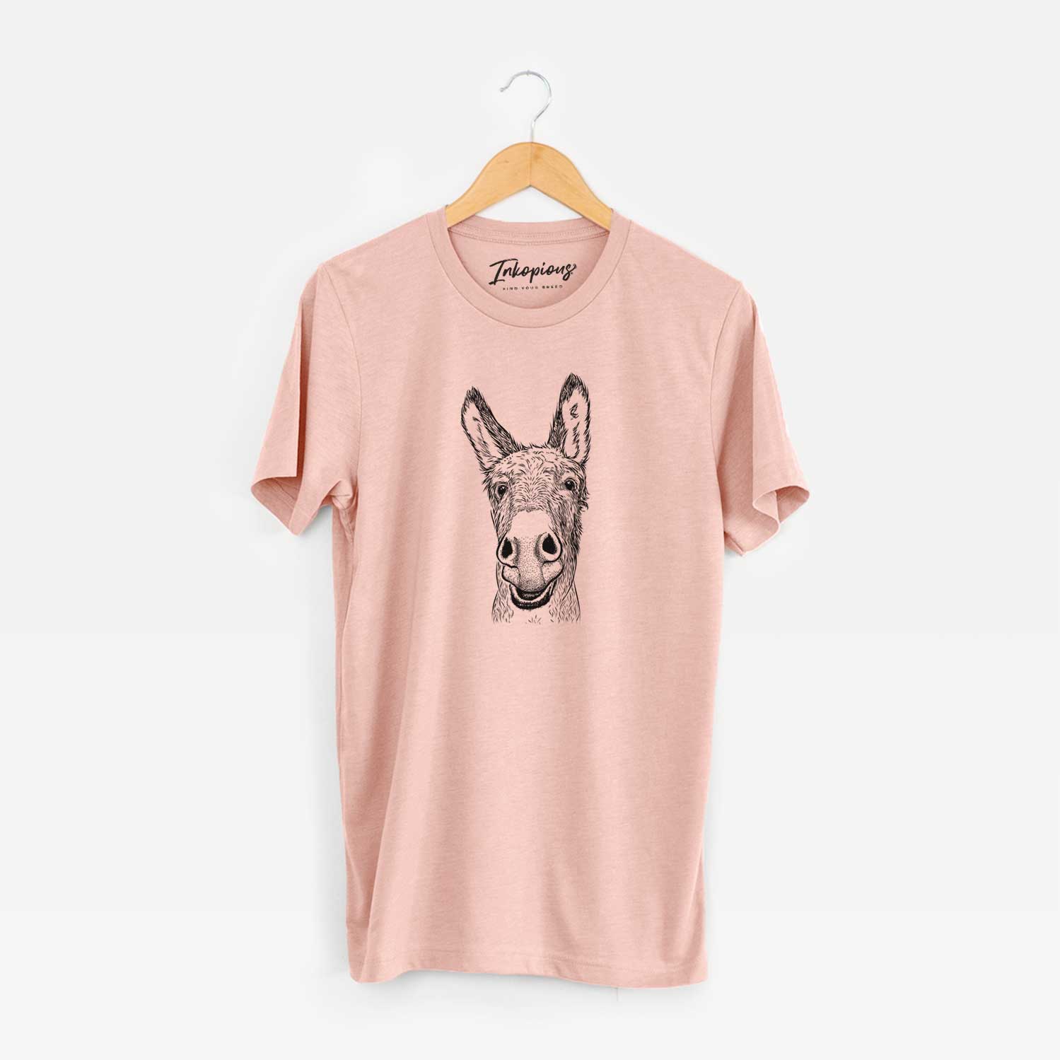 Hand-drawn sketch of Samule the Donkey on a Peach Unisex crewneck