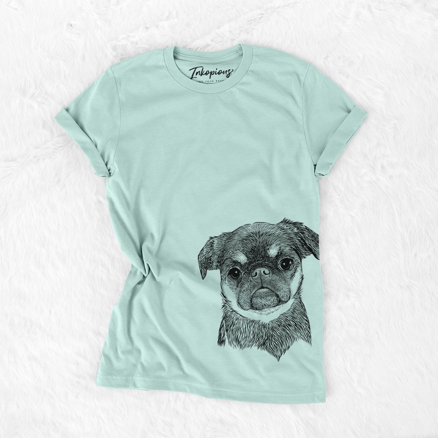 Hand-drawn sketch of Simone the Brussels Griffon on a Heather Sage Unisex crewneck