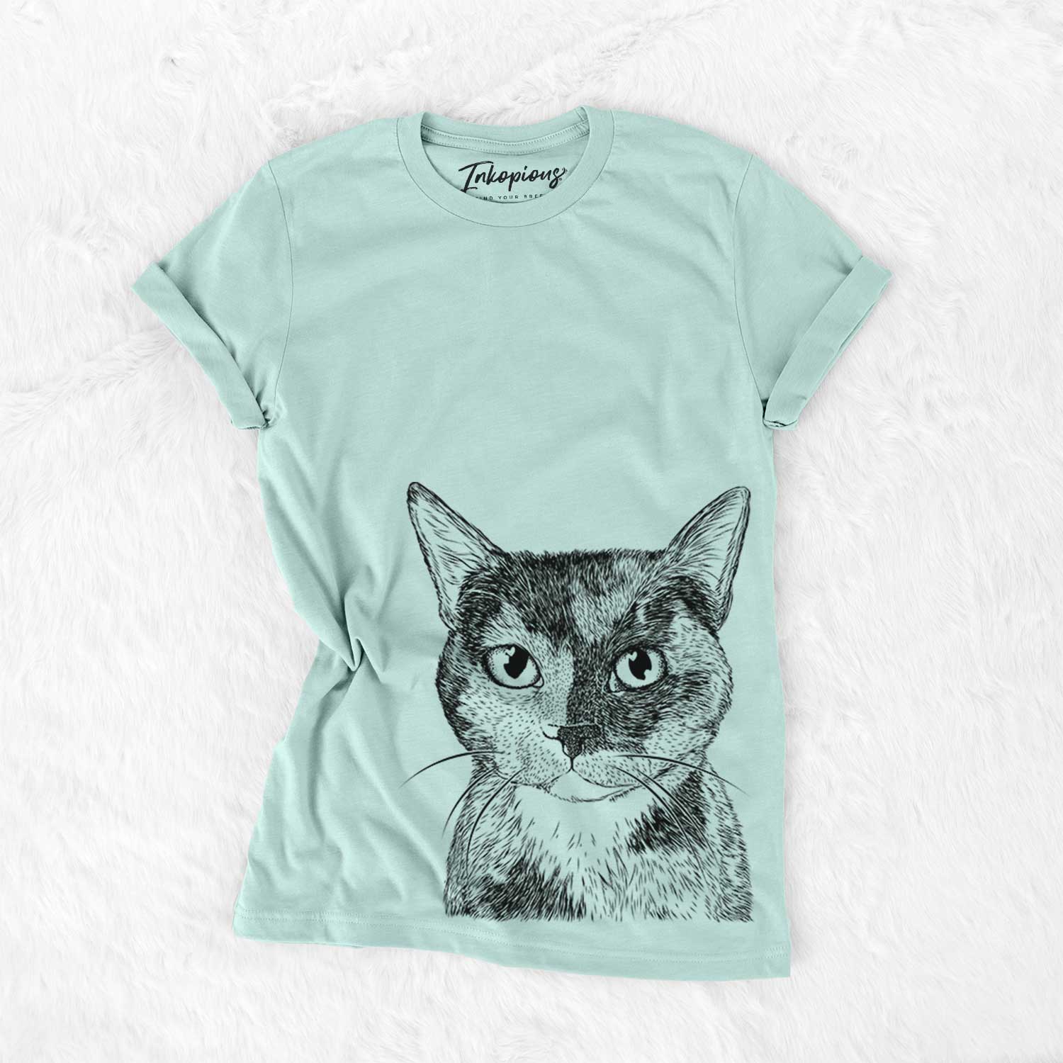 Hand-drawn sketch of Spooky Kitty the Tortoiseshell Cat on a Heather Sage Bella Canvas Unisex Crewneck