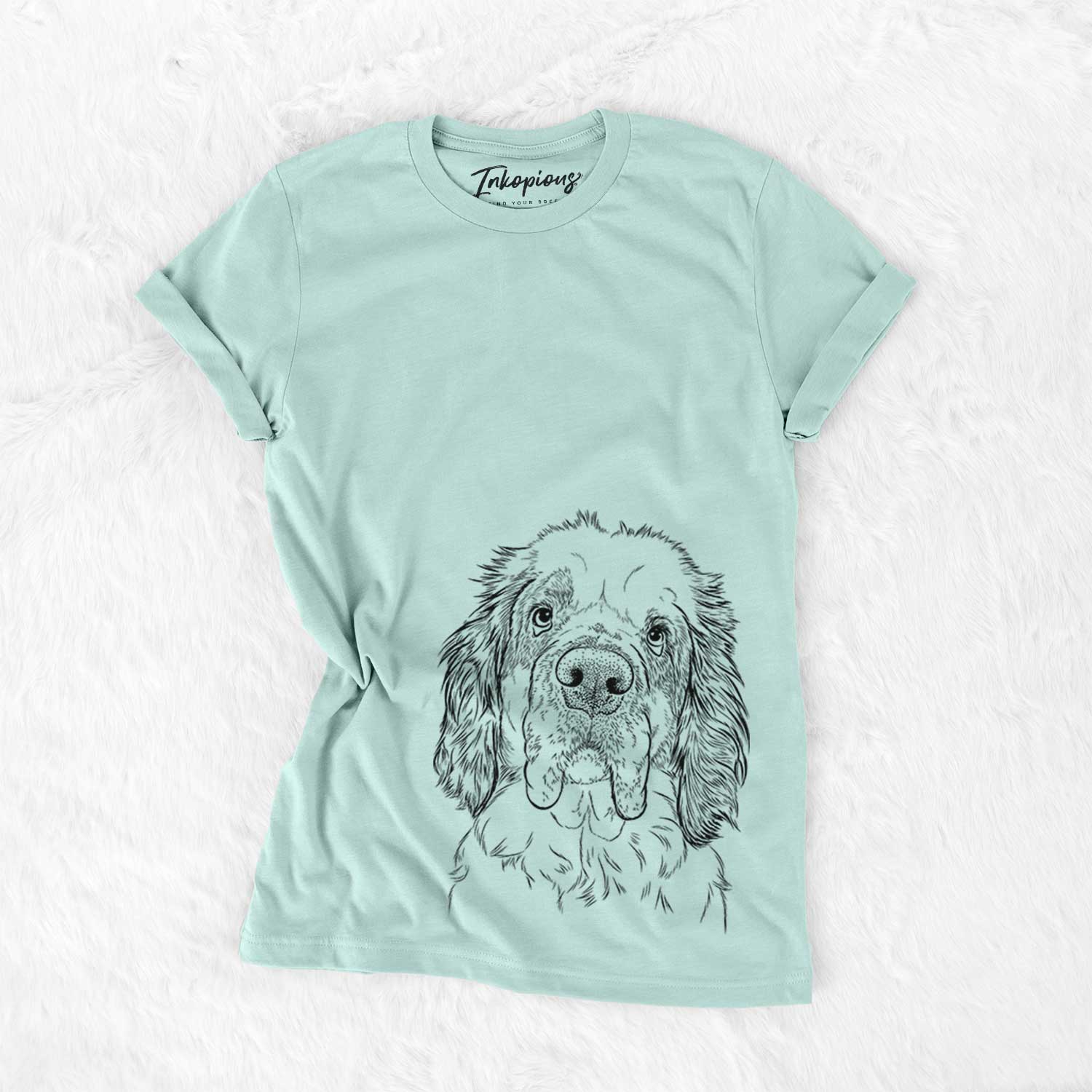 Hand-drawn sketch of Sully the Clumber Spaniel on a Heather Sage Unisex crewneck