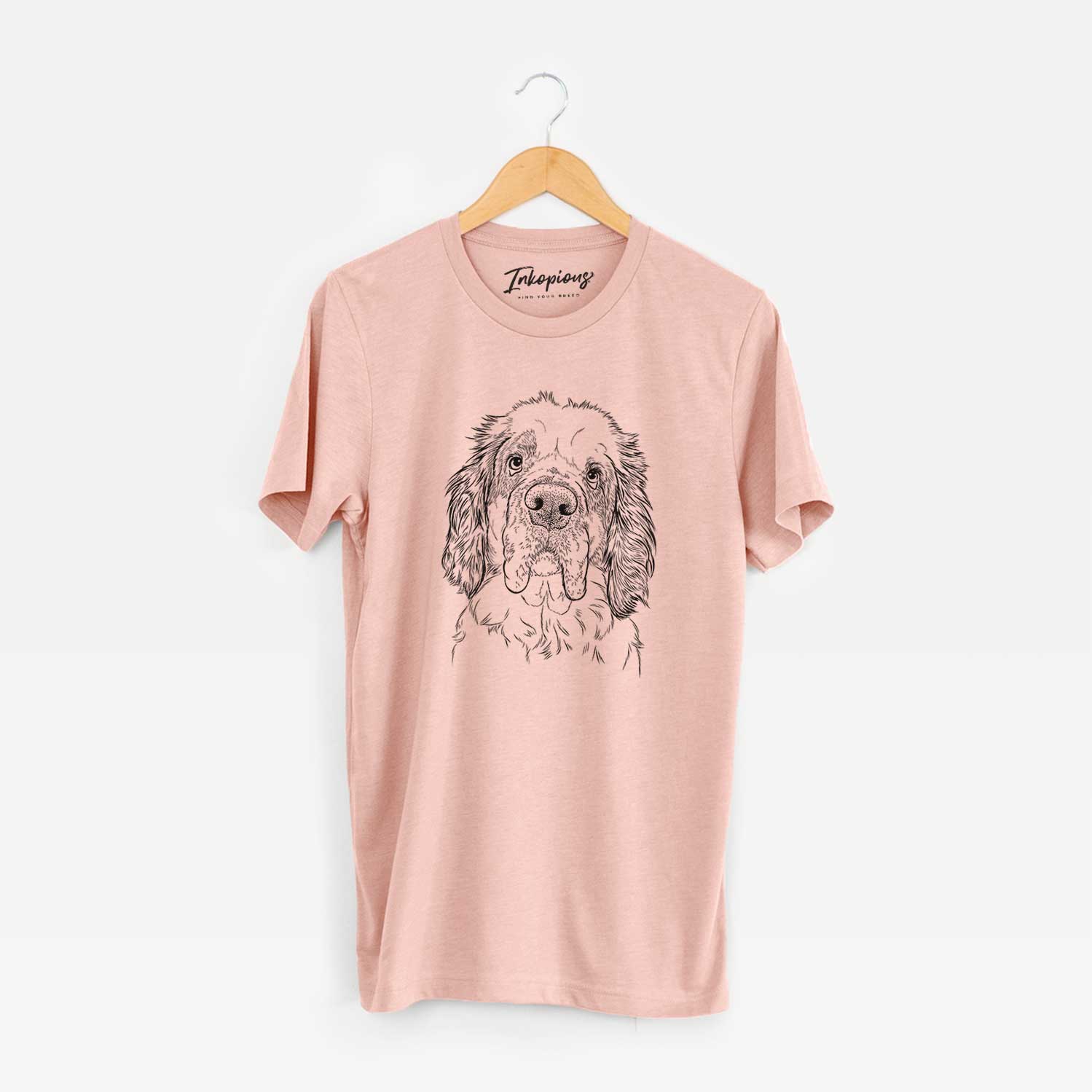 Hand-drawn sketch of Sully the Clumber Spaniel on a Peach Unisex crewneck