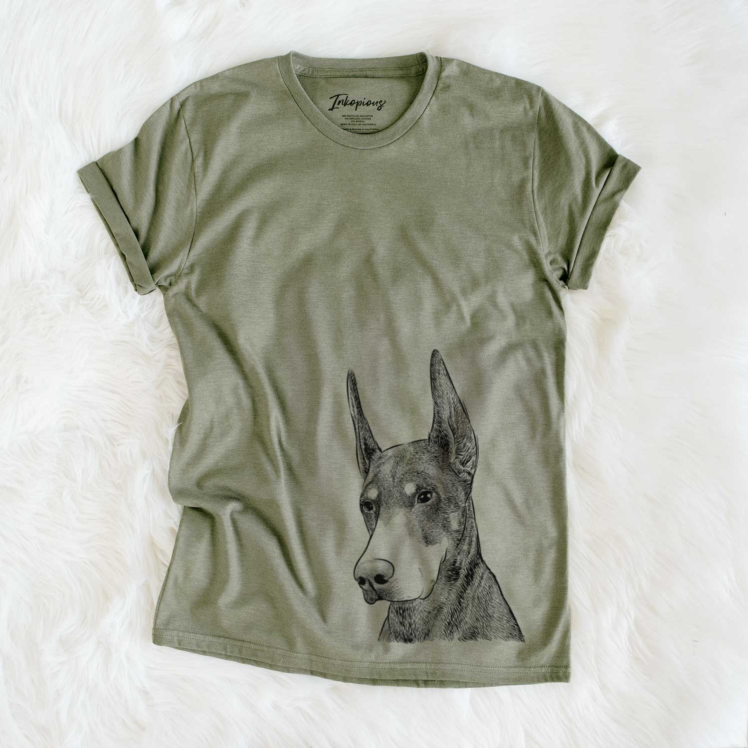 Hand-drawn sketch of Sunny the Doberman Pinscher on an Olive Unisex crewneck