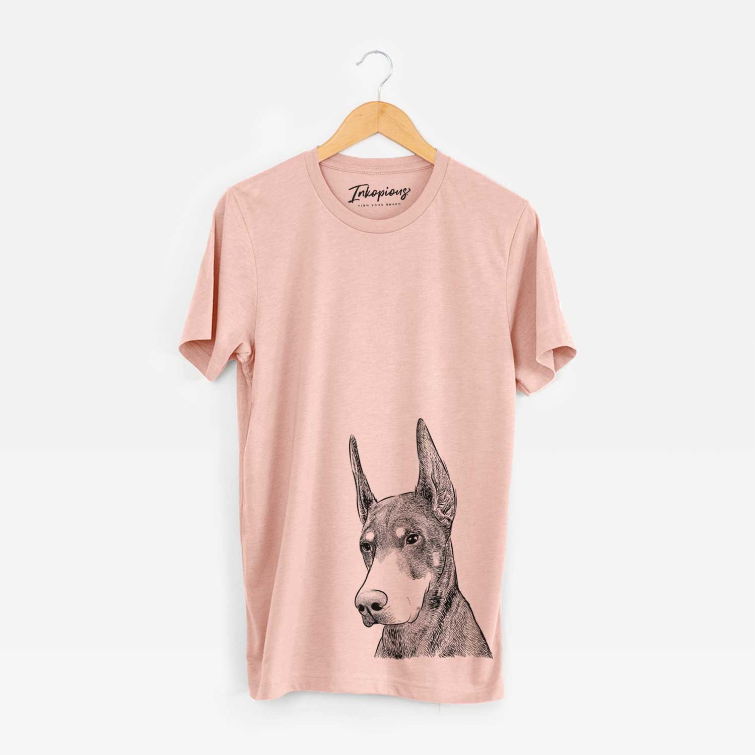 Hand-drawn sketch of Sunny the Doberman Pinscher on a Peach Bella Canvas Unisex Crewneck