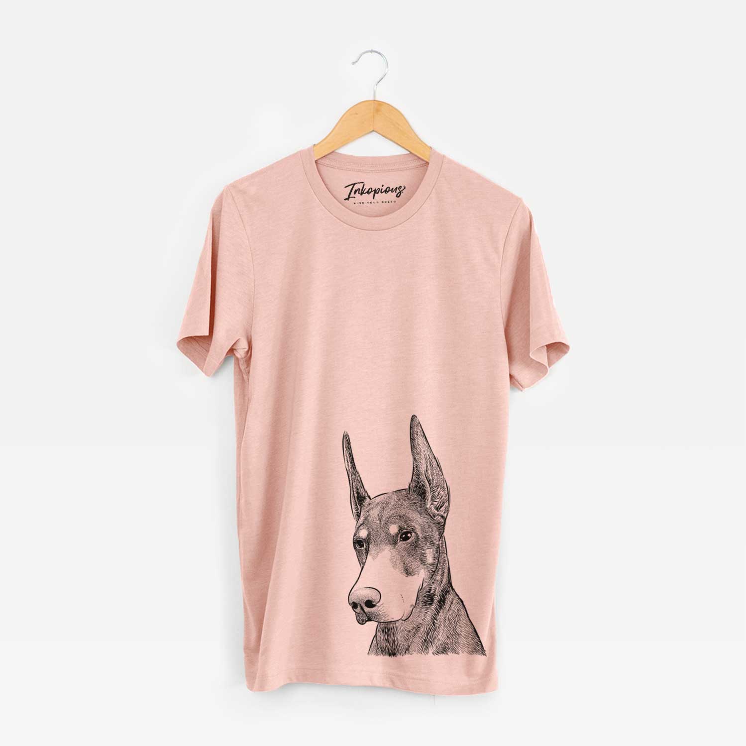 Hand-drawn sketch of Sunny the Doberman Pinscher on a Peach Unisex crewneck