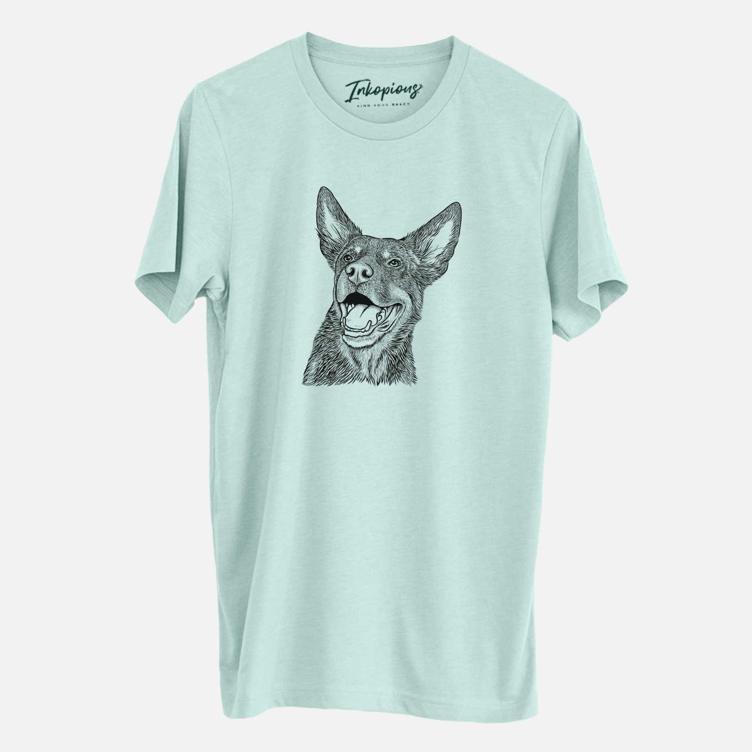 Hand-drawn sketch of Tucker the Australian Kelpie on a Heather Sage Unisex crewneck