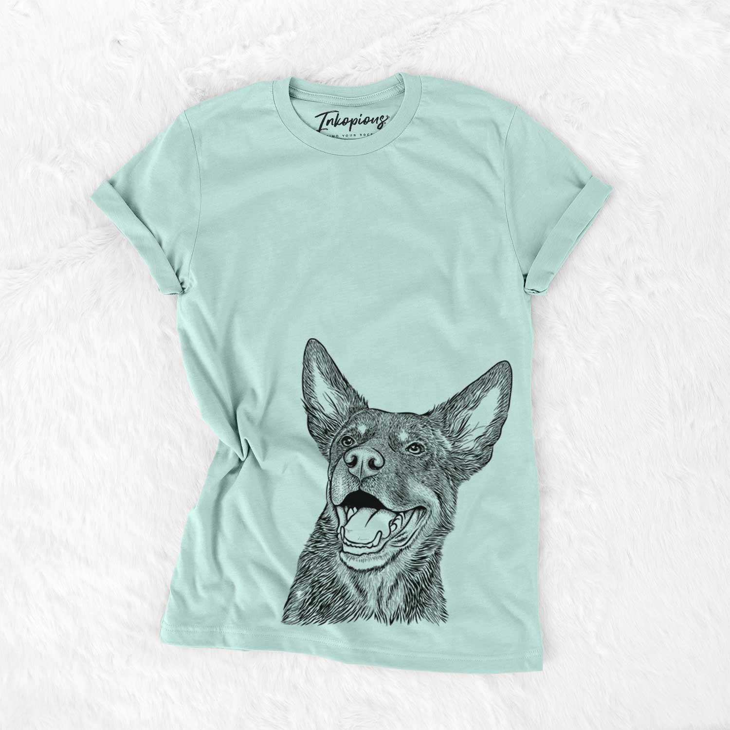 Hand-drawn sketch of Tucker the Australian Kelpie on a Heather Sage Unisex crewneck