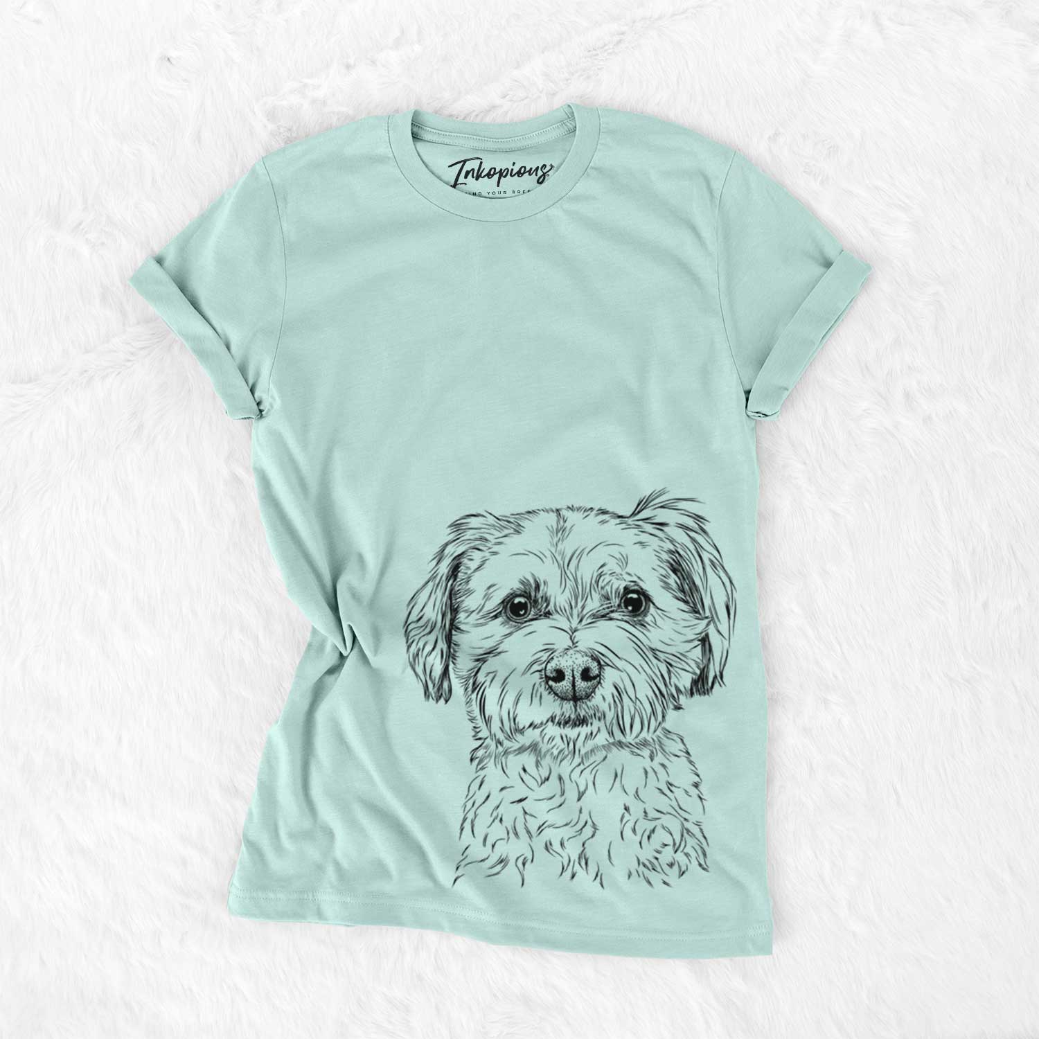Hand-drawn sketch of Wyatt the Coton de Tulear on a Heather Sage Unisex crewneck