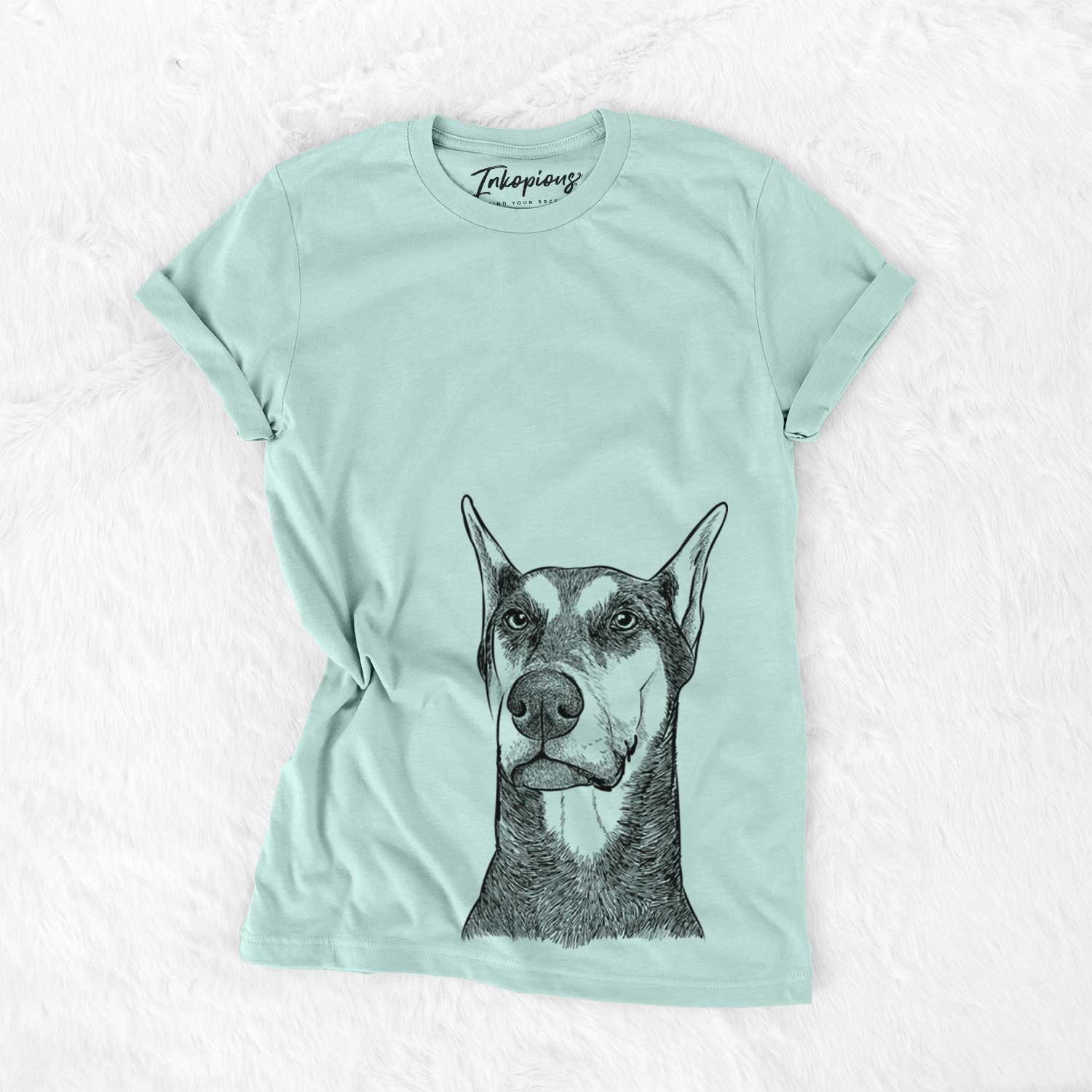Hand-drawn sketch of Zeus the Doberman Pinscher on a Heather Sage Unisex crewneck